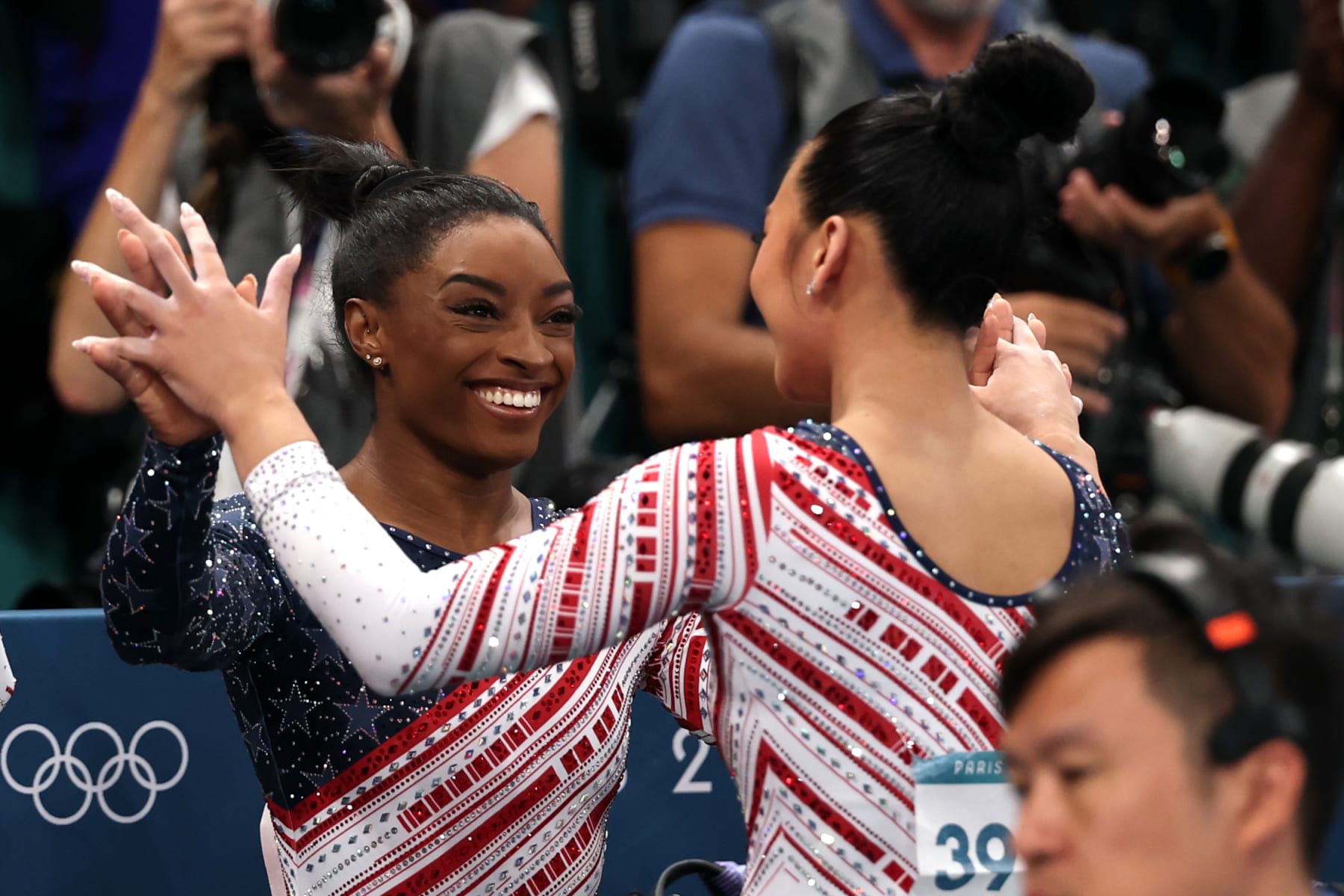 PARIS, FRANCE - JULY 30: Sunisa Lee of Team United States reacts with teammate Simone Biles following her routine on the balance beam during the Artistic Gymnastics Women's Team Final on day four of the Olympic Games Paris 2024 at Bercy Arena on July 30, 2024 in Paris, France. (Photo by Jamie Squire/Getty Images)