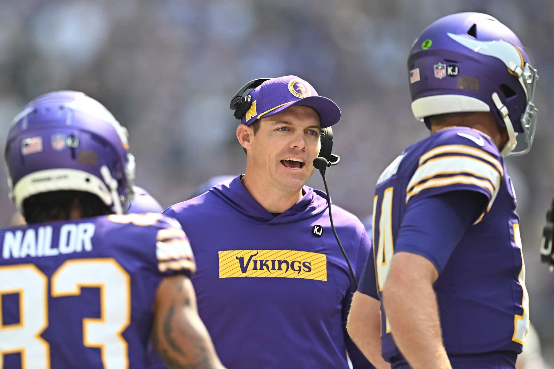 MINNEAPOLIS, MINNESOTA - SEPTEMBER 22: Kevin O'Connell, head coach of the Minnesota Vikings, speaks to quarterback Sam Darnold #14 during the first quarter against the Houston Texans at U.S. Bank Stadium on September 22, 2024 in Minneapolis, Minnesota. (Photo by Stephen Maturen/Getty Images)