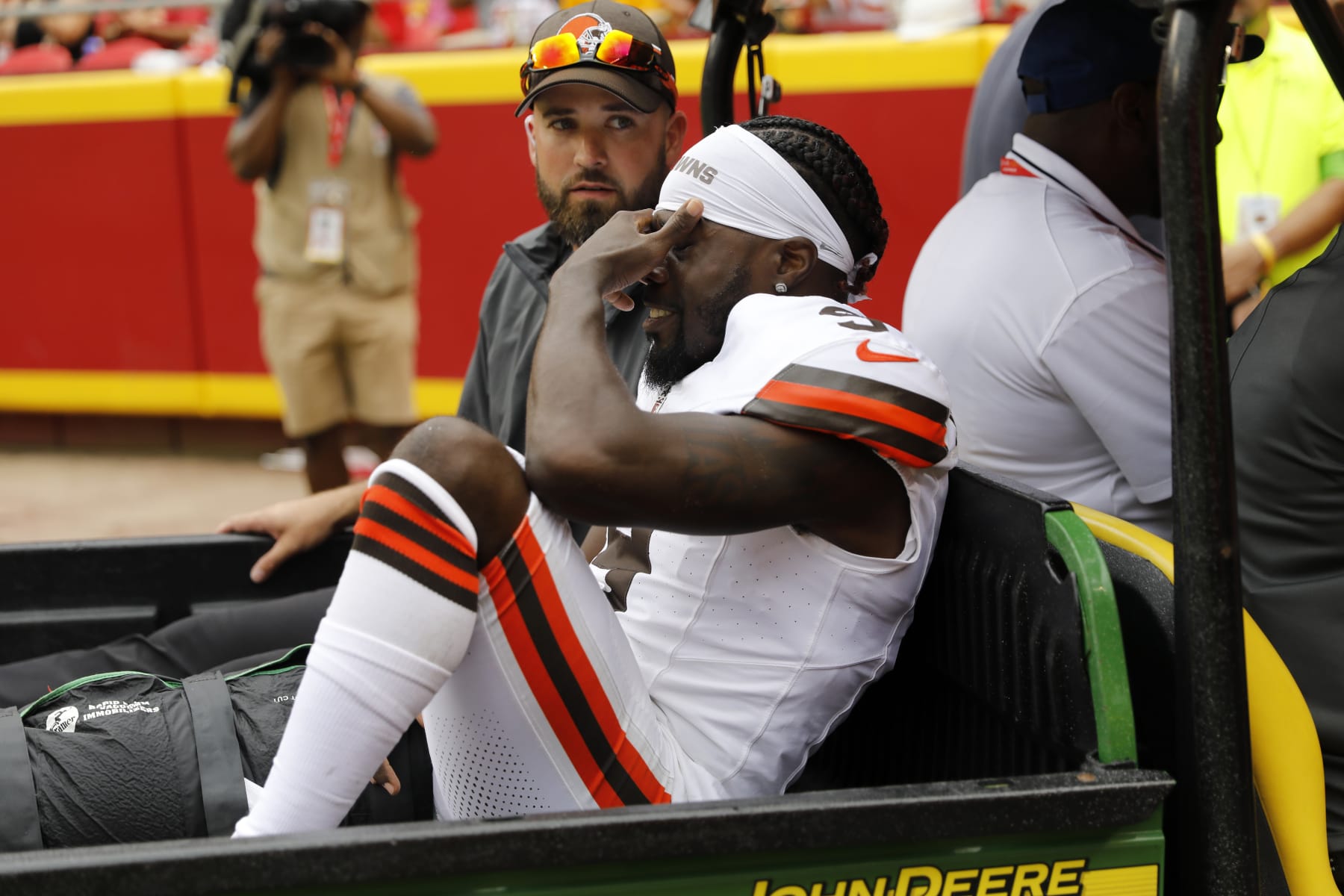 KANSAS CITY, MISSOURI - AUGUST 26: Jakeem Grant Sr. #9 of the Cleveland Browns reacts as he is carted off the field on the opening play of a preseason game against the Kansas City Chiefs at GEHA Field at Arrowhead Stadium on August 26, 2023 in Kansas City, Missouri. (Photo by David Eulitt/Getty Images)