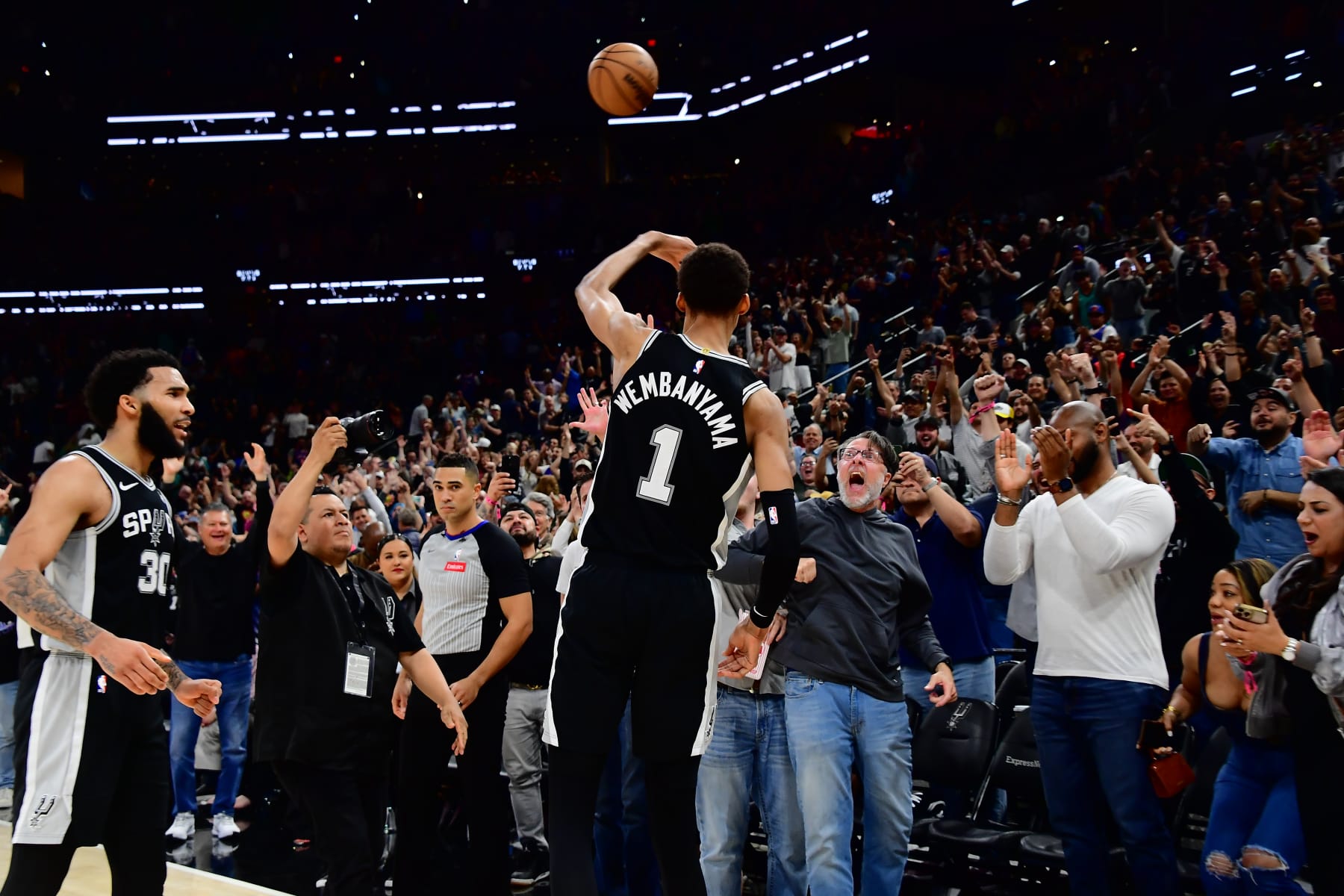SAN ANTONIO, TX - MARCH 29: Victor Wembanyama #1 of the San Antonio Spurs throws the ball to fans after the game against the New York Knicks on March 29, 2024 at the Frost Bank Center in San Antonio, Texas. NOTE TO USER: User expressly acknowledges and agrees that, by downloading and or using this photograph, user is consenting to the terms and conditions of the Getty Images License Agreement. Mandatory Copyright Notice: Copyright 2024 NBAE (Photos by Michael Gonzales/NBAE via Getty Images)