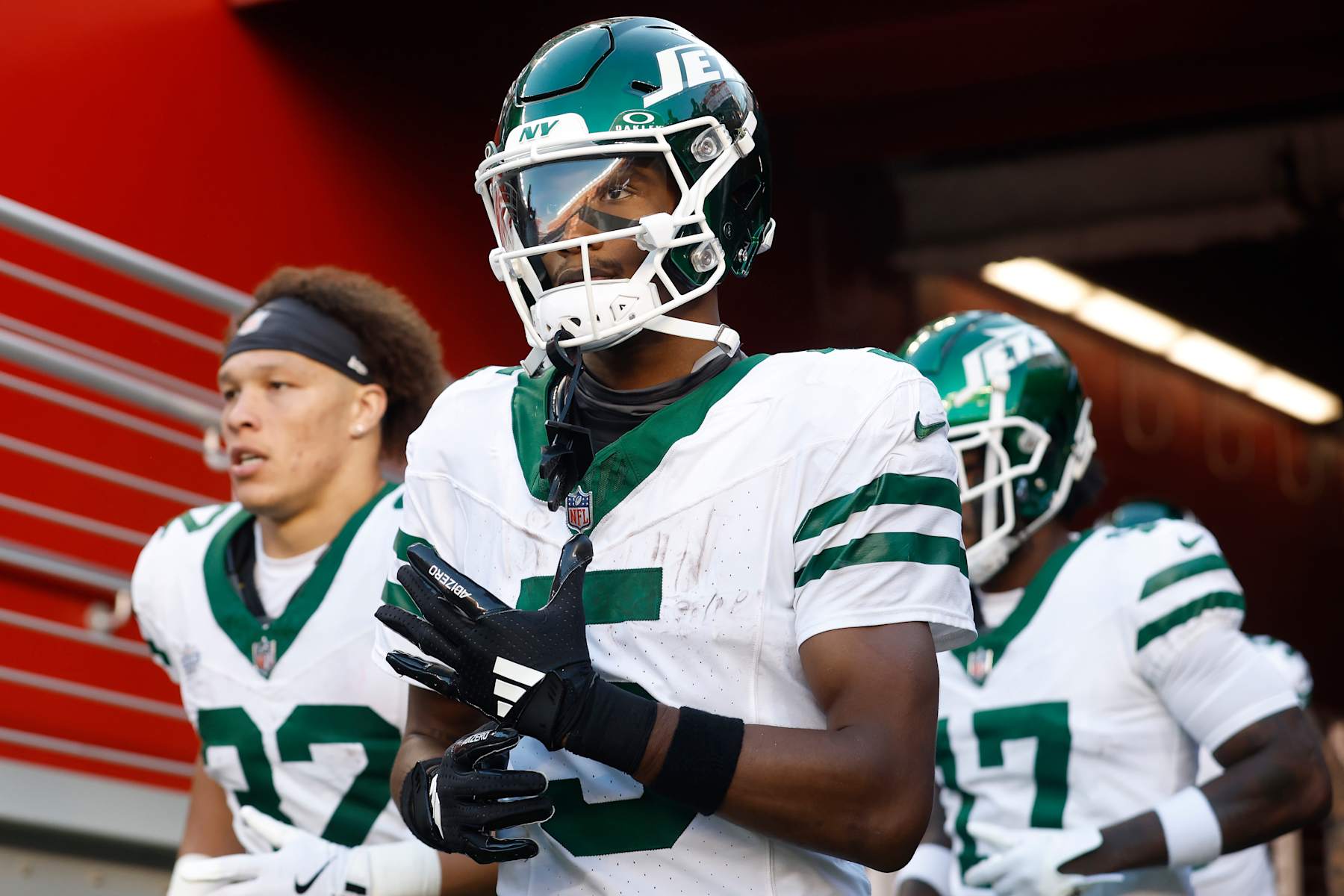 SANTA CLARA, CALIFORNIA - SEPTEMBER 09: Wide receiver Garrett Wilson #5 (C) of the New York Jets comes out of the tunnel with teammates for the second half of the game against the San Francisco 49ers at Levi's Stadium on September 09, 2024 in Santa Clara, California. (Photo by Lachlan Cunningham/Getty Images)