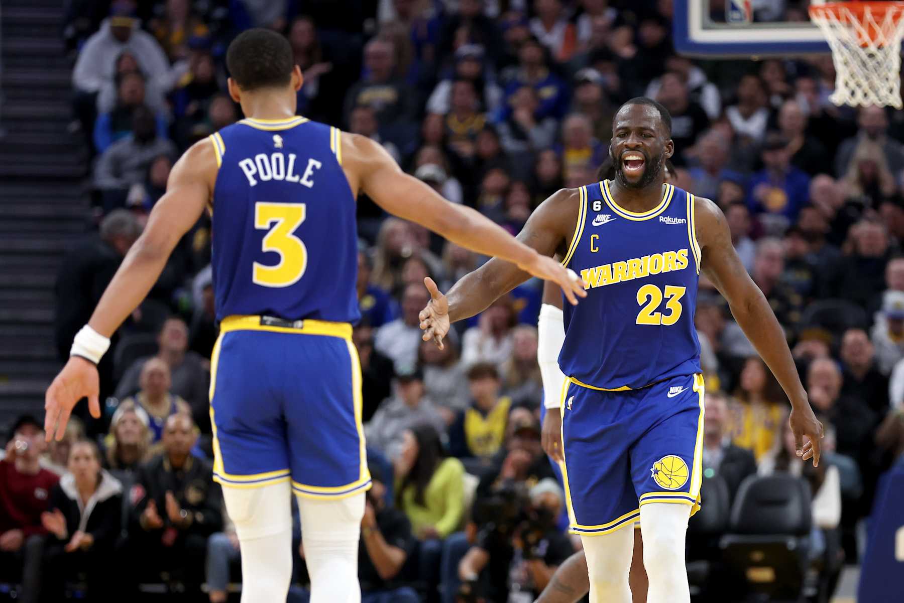 SAN FRANCISCO, CALIFORNIA - NOVEMBER 14: Draymond Green #23 of the Golden State Warriors congratulates Jordan Poole #3 after he made a basket against the San Antonio Spurs at Chase Center on November 14, 2022 in San Francisco, California. NOTE TO USER: User expressly acknowledges and agrees that, by downloading and or using this photograph, User is consenting to the terms and conditions of the Getty Images License Agreement.  (Photo by Ezra Shaw/Getty Images)