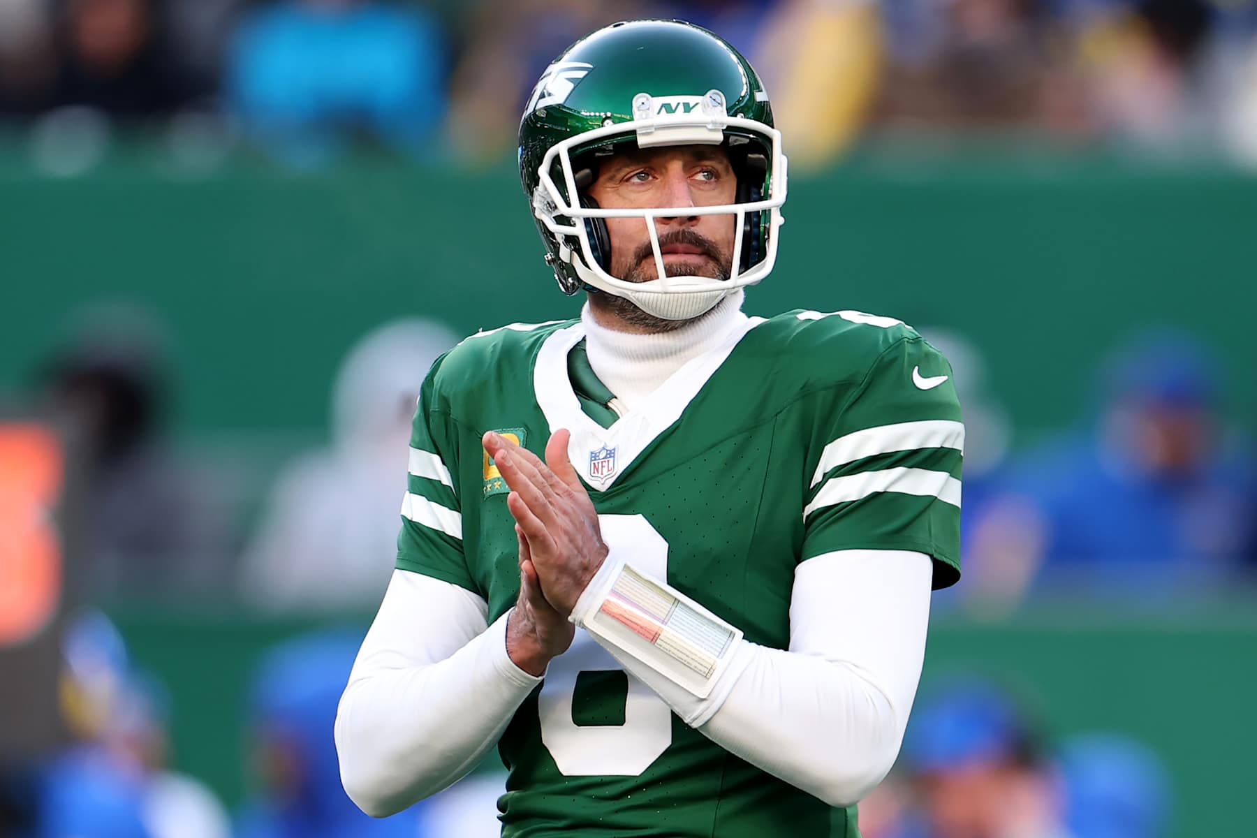 EAST RUTHERFORD, NEW JERSEY - DECEMBER 22: Aaron Rodgers #8 of the New York Jets reacts during a game against the Los Angeles Rams at MetLife Stadium on December 22, 2024 in East Rutherford, New Jersey. (Photo by Emilee Chinn/Getty Images)