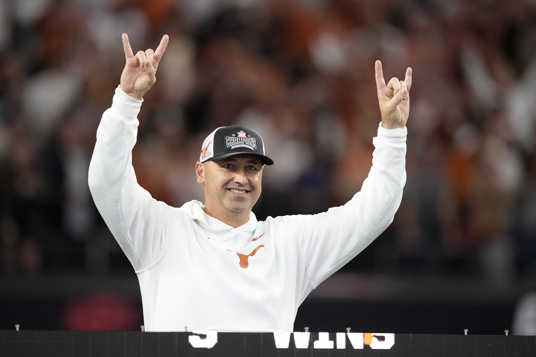 Texas head coach Steve Sarkisian celebrates after his team won the Big 12 Conference championship NCAA college football game against Oklahoma State in Arlington, Texas, Saturday, Dec. 2, 2023. (AP Photo/Tony Gutierrez)