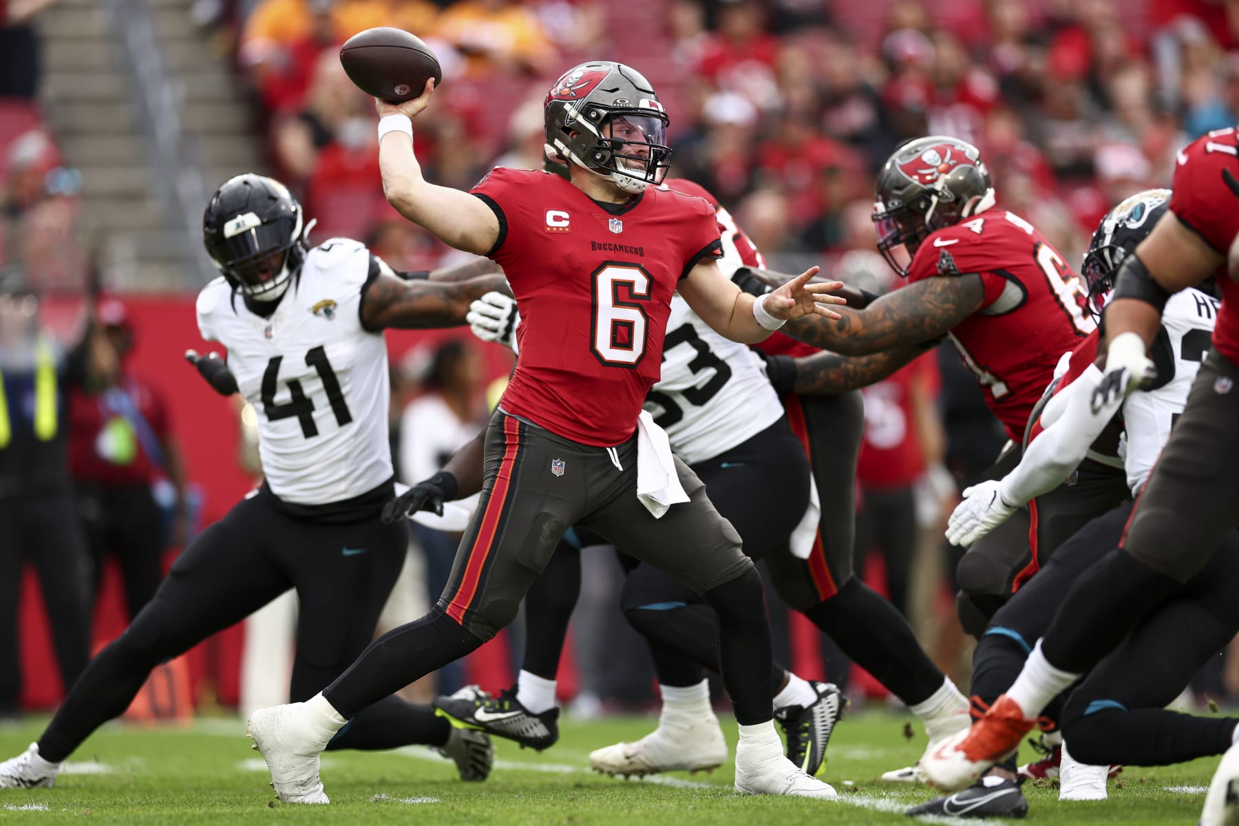 TAMPA, FL - DECEMBER 24: Baker Mayfield #6 of the Tampa Bay Buccaneers throws a pass during the first quarter of an NFL football game against the Jacksonville Jaguars at Raymond James Stadium on December 24, 2023 in Tampa, Florida. (Photo by Kevin Sabitus/Getty Images)