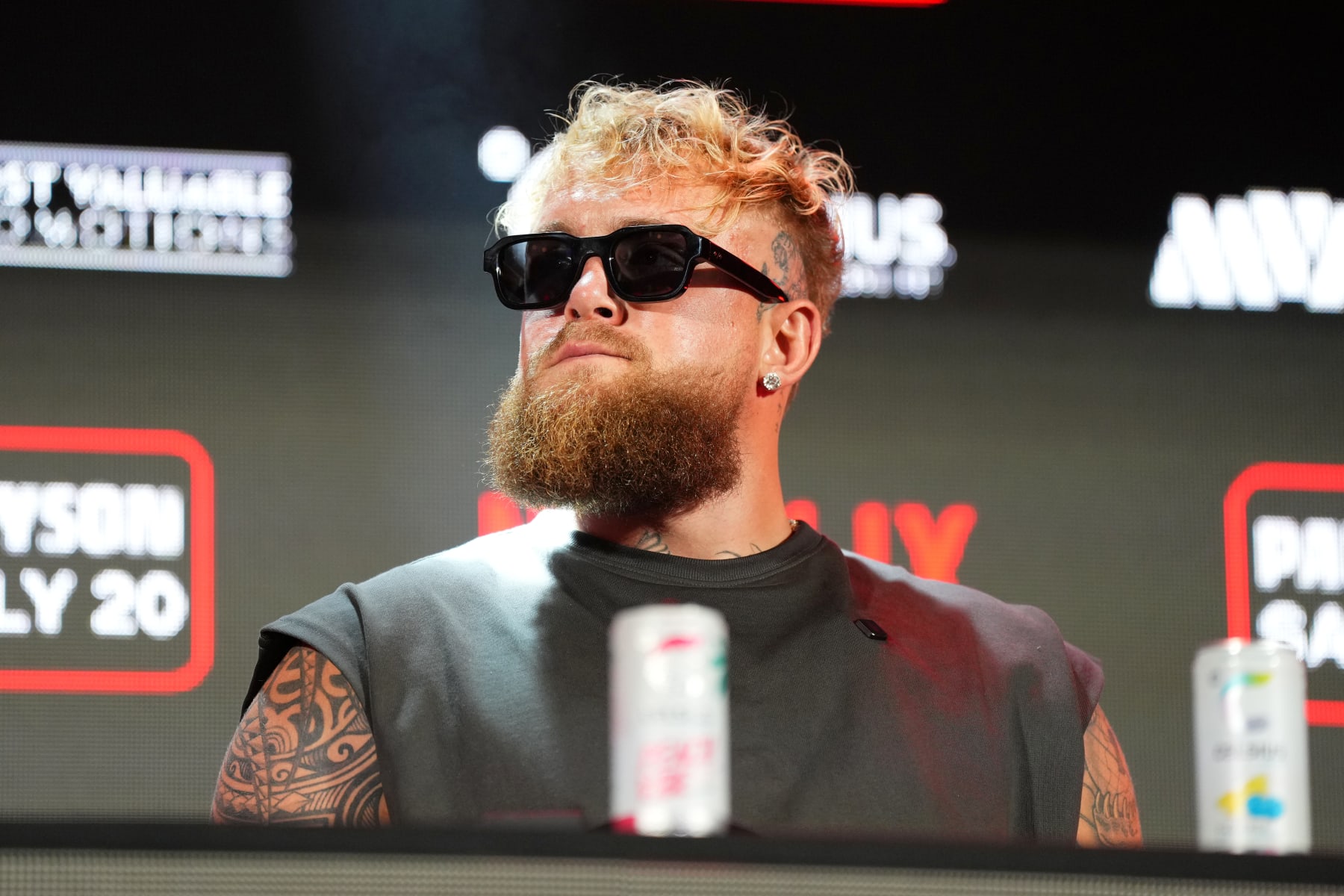 ARLINGTON, TEXAS - MAY 16: Jake Paul speaks onstage during the Jake Paul vs. Mike Tyson Boxing match Arlington press conference at Texas Live! on May 16, 2024 in Arlington, Texas.  (Photo by Cooper Neill/Getty Images for Netflix)