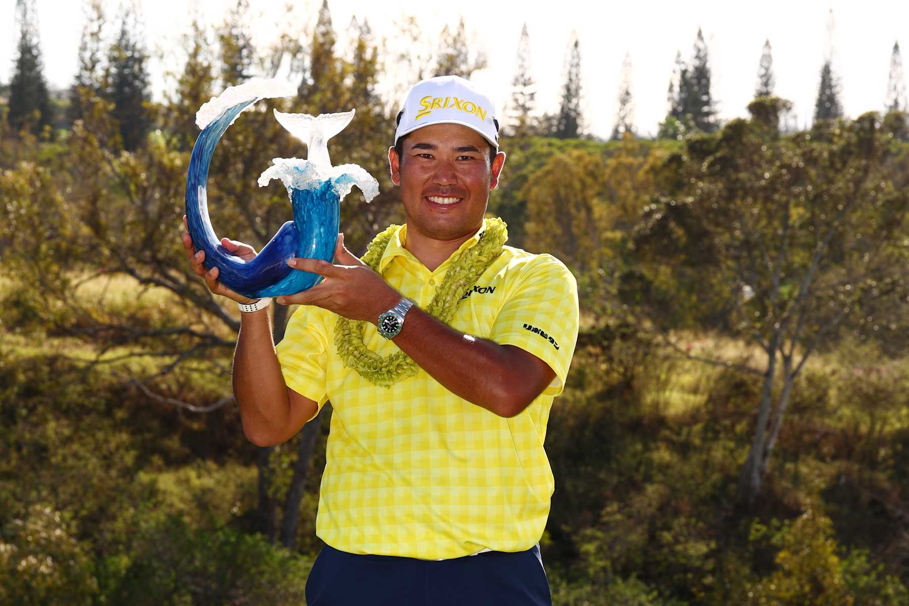 KAPALUA, HAWAII - JANUARY 05: Hideki Matsuyama of Japan poses with the trophy after winning The Sentry 2025 at Plantation Course at Kapalua Golf Club on January 05, 2025 in Kapalua, Hawaii. Matsuyama sets the PGA TOUR record for lowest 72-hole score to par with -35. (Photo by Maddie Meyer/Getty Images)