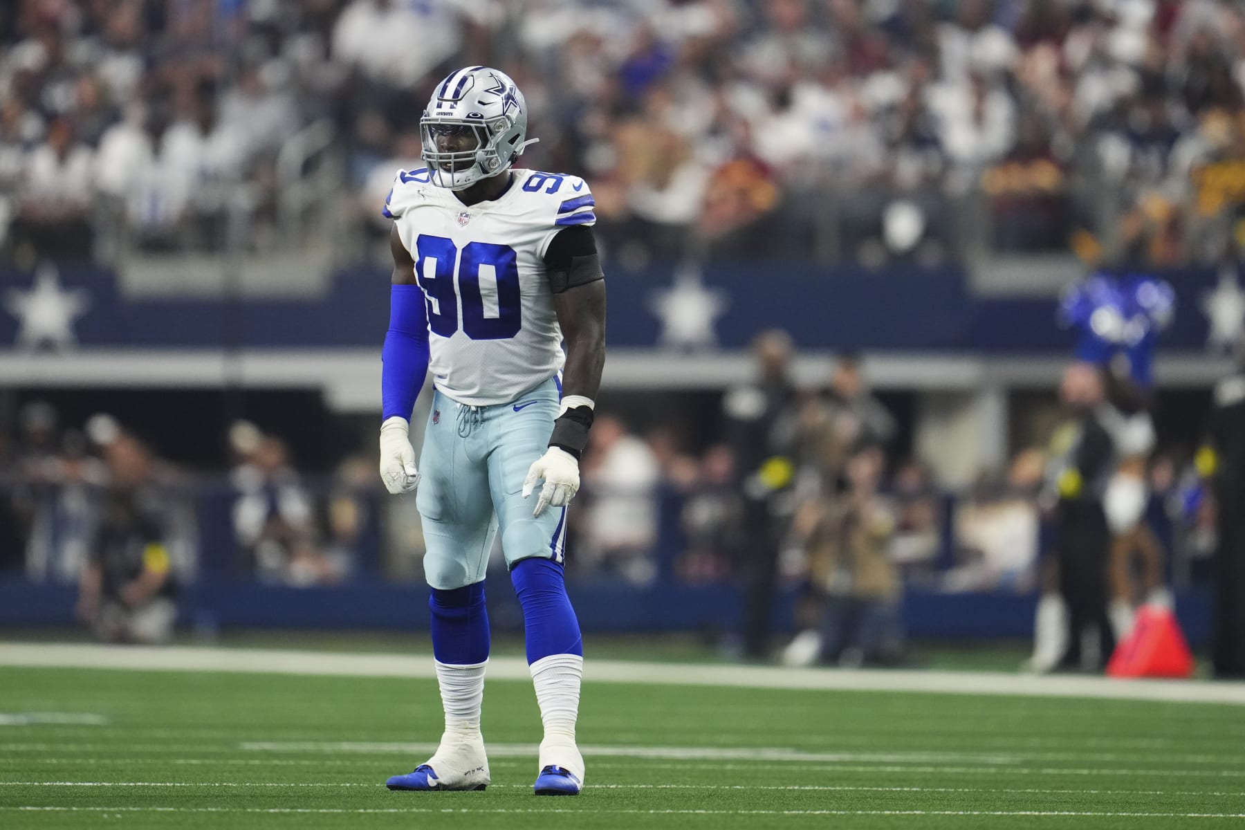 ARLINGTON, TX - OCTOBER 02: DeMarcus Lawrence #90 of the Dallas Cowboys gets set against the Washington Commanders at AT&T Stadium on October 2, 2022 in Arlington, Texas. (Photo by Cooper Neill/Getty Images)