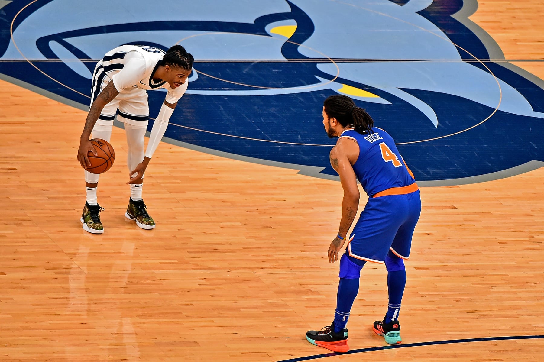 MEMPHIS, TENNESSEE - MAY 03: Ja Morant #12 of the Memphis Grizzlies handles the ball against Derrick Rose #4 of the New York Knicks during the first half at FedExForum on May 03, 2021 in Memphis, Tennessee. NOTE TO USER: User expressly acknowledges and agrees that, by downloading and or using this photograph, User is consenting to the terms and conditions of the Getty Images License Agreement. (Photo by Justin Ford/Getty Images)