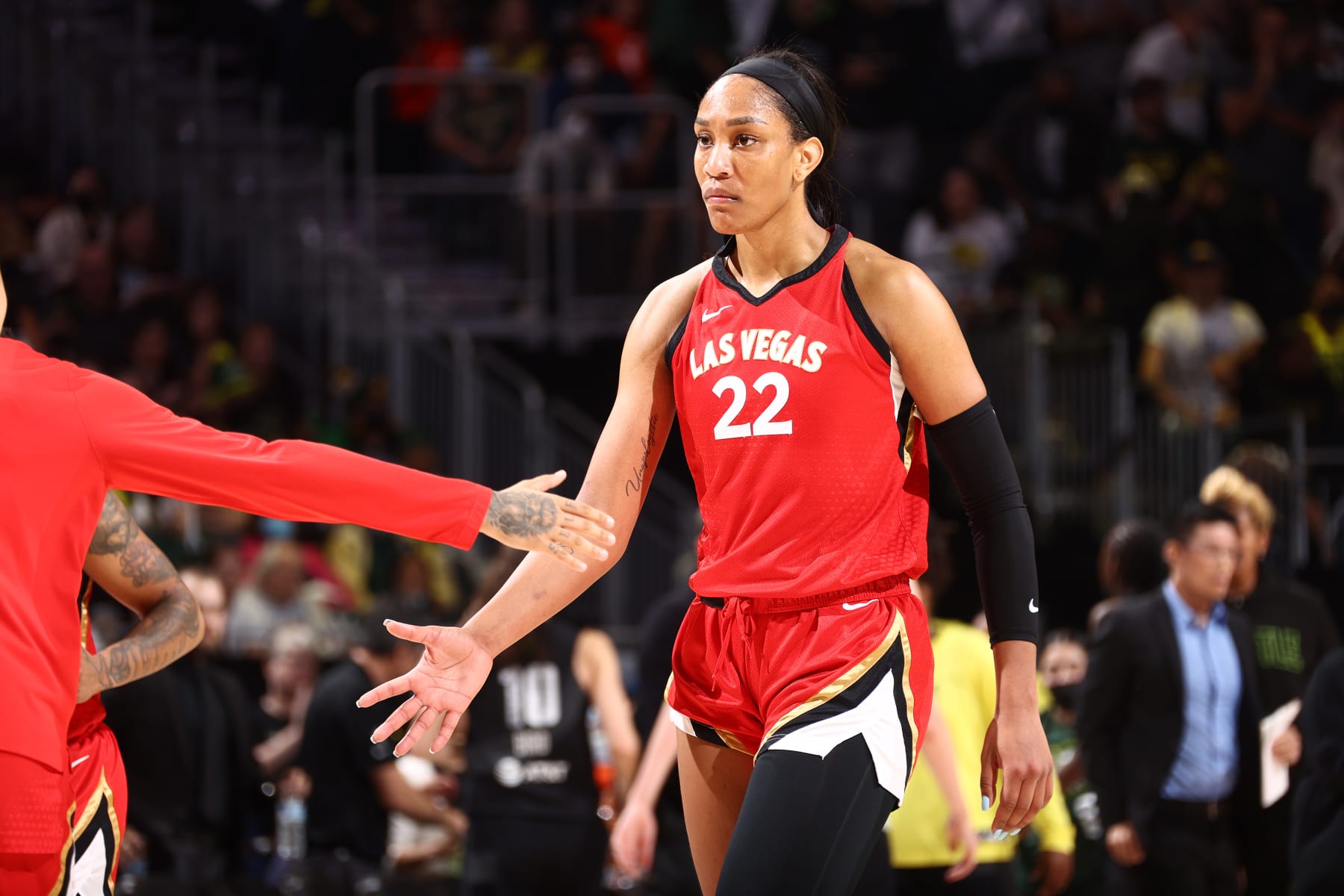 SEATTLE, WA - SEPTEMBER 6: A'ja Wilson #22 of the Las Vegas Aces high fives team mate during the game against the Seattle Storm on September 6, 2022 at Climate Pledge Arena in Seattle, Washington. NOTE TO USER: User expressly acknowledges and agrees that, by downloading and or using this photograph, User is consenting to the terms and conditions of the Getty Images License Agreement. Mandatory Copyright Notice: Copyright 2022 NBAE (Photo by Ned Dishman/NBAE via Getty Images)