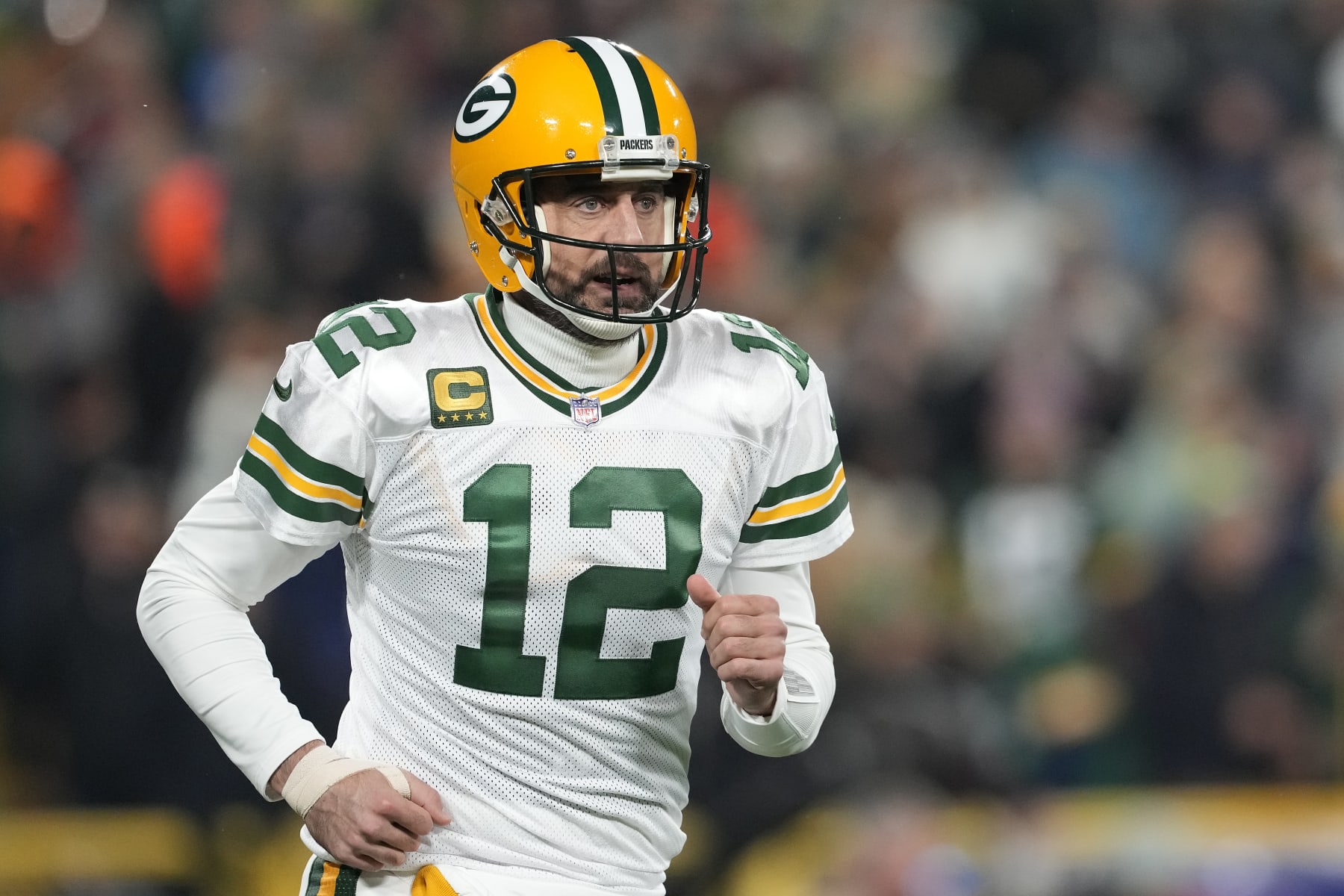 GREEN BAY, WISCONSIN - NOVEMBER 17: Aaron Rodgers #12 of the Green Bay Packers reacts after a play against the Tennessee Titans in the first half at Lambeau Field on November 17, 2022 in Green Bay, Wisconsin. (Photo by Patrick McDermott/Getty Images)