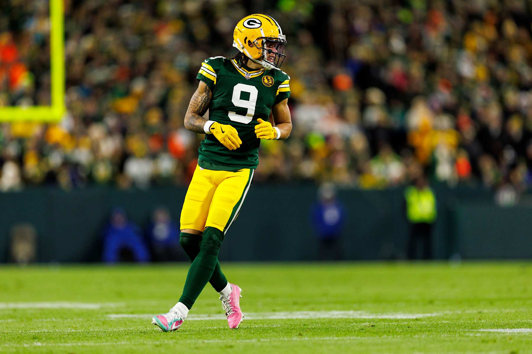 GREEN BAY, WISCONSIN - NOVEMBER 28: Wide receiver Christian Watson #9 of the Green Bay Packers gets set during an NFL game against the Miami Dolphins at Lambeau Field on November 28, 2024 in Green Bay, Wisconsin. (Photo by Brooke Sutton/Getty Images)