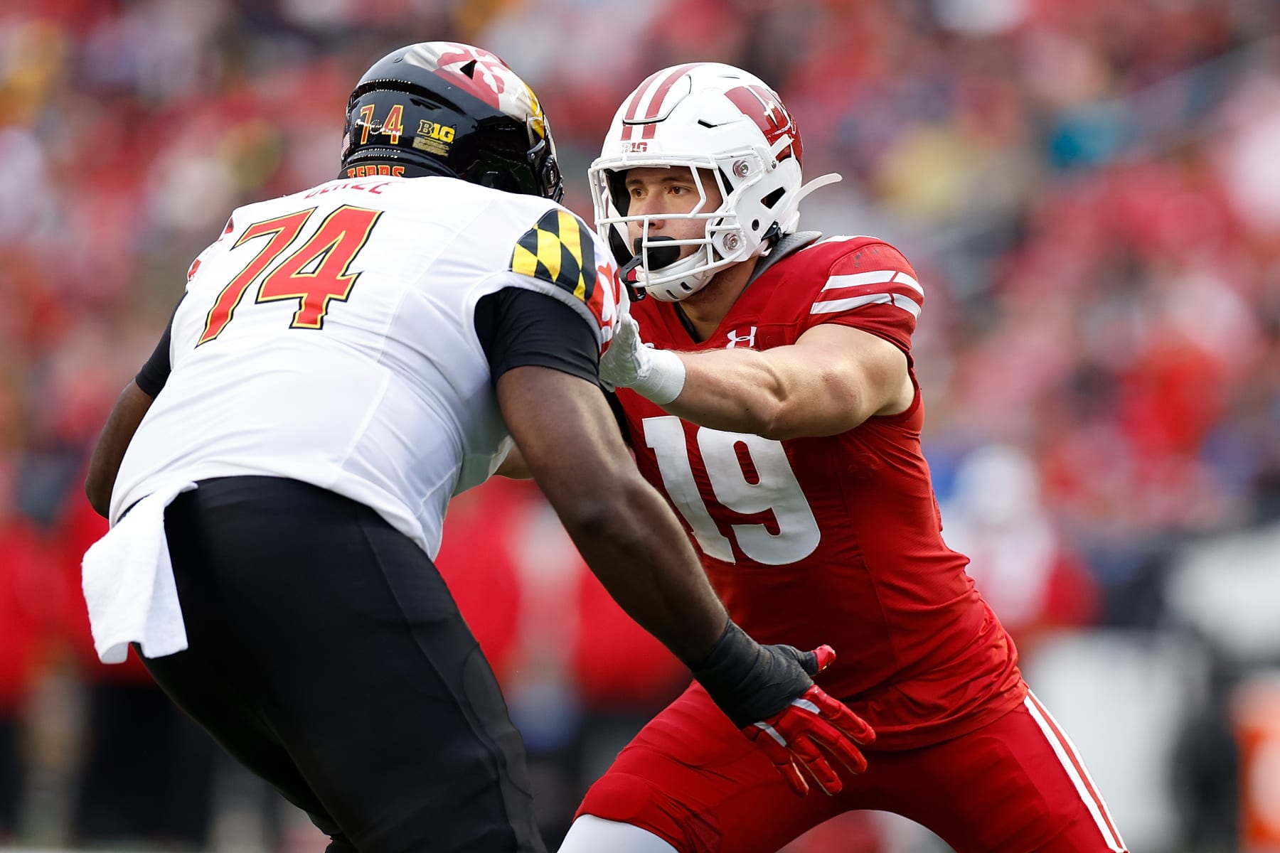 MADISON, WISCONSIN - NOVEMBER 05: Nick Herbig #19 of the Wisconsin Badgers reacts toward the play Maryland Terrapins at Camp Randall Stadium on November 05, 2022 in Madison, Wisconsin. (Photo by John Fisher/Getty Images)