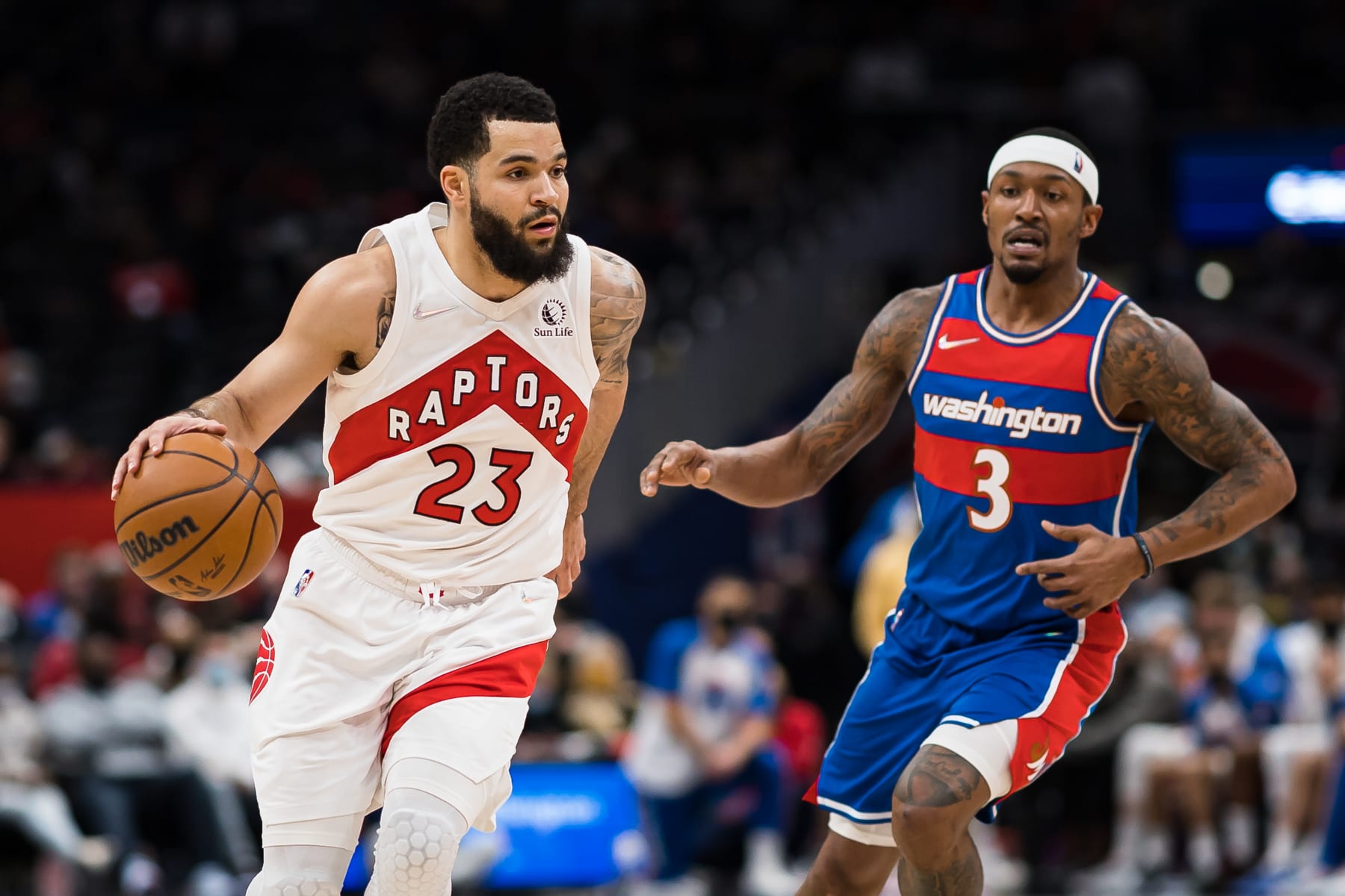 WASHINGTON, DC - JANUARY 21: Fred VanVleet #23 of the Toronto Raptors brings the ball up court against Bradley Beal #3 of the Washington Wizards during the first half at Capital One Arena on January 21, 2022 in Washington, DC. NOTE TO USER: User expressly acknowledges and agrees that, by downloading and or using this photograph, User is consenting to the terms and conditions of the Getty Images License Agreement. (Photo by Scott Taetsch/Getty Images)