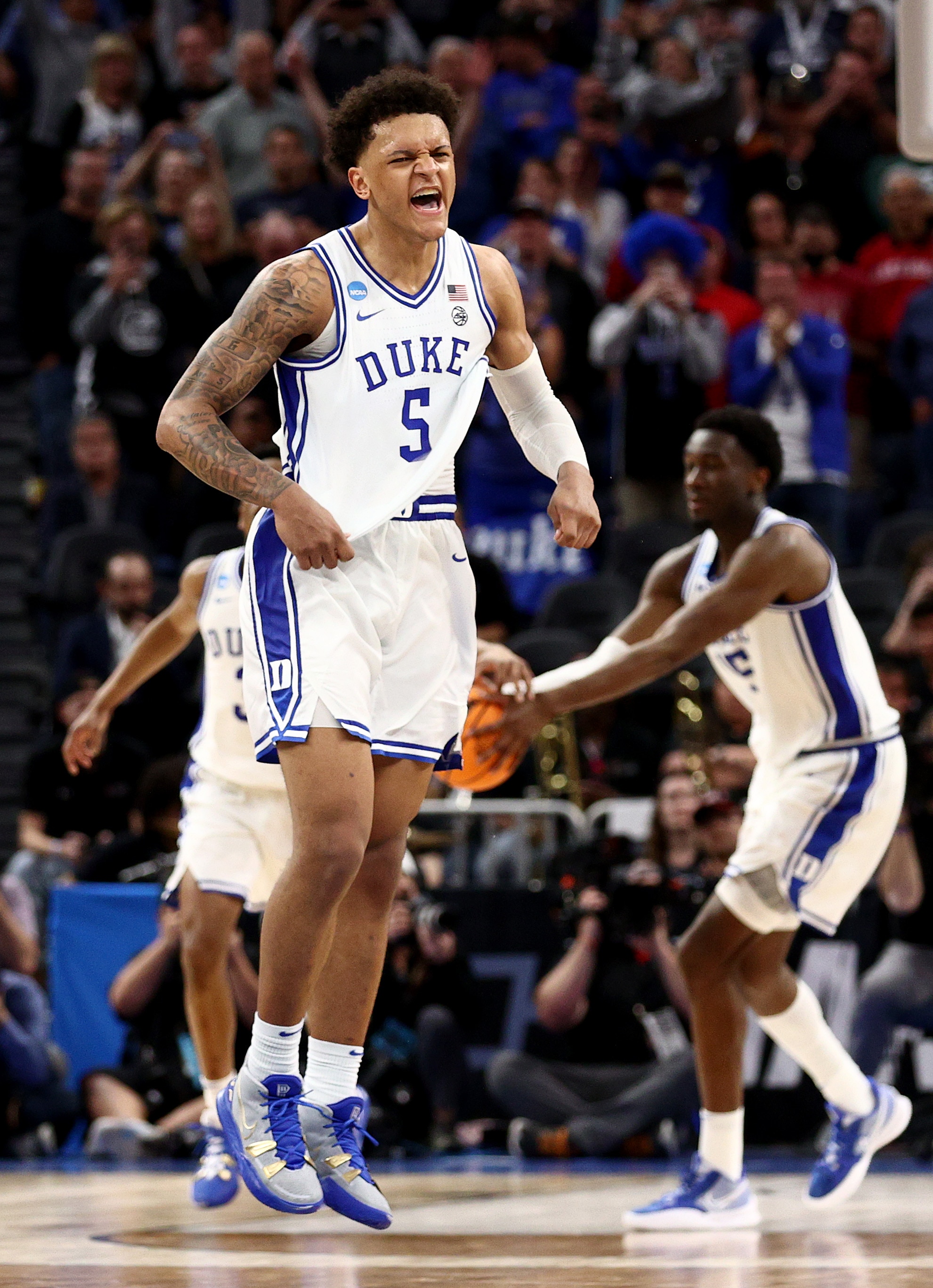 SAN FRANCISCO, CALIFORNIA - MARCH 24: Paolo Banchero #5 of the Duke Blue Devils celebrates defeating the Texas Tech Red Raiders with a final score of 73-78 in the Sweet Sixteen round game of the 2022 NCAA Men's Basketball Tournament at Chase Center on March 24, 2022 in San Francisco, California. (Photo by Ezra Shaw/Getty Images)