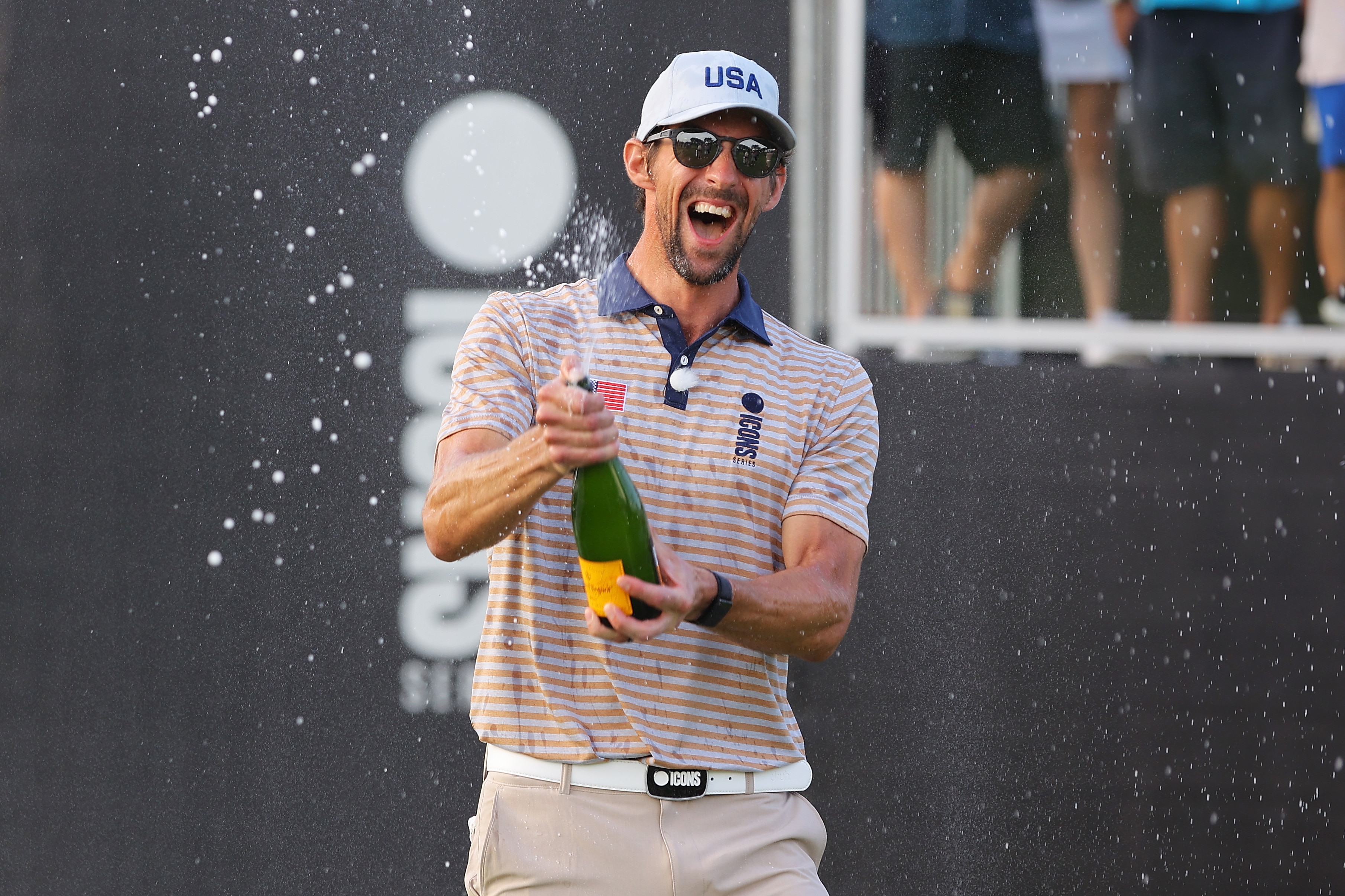 JERSEY CITY, NEW JERSEY - JULY 01: Michael Phelps celebrates after Team USA wins the  2022 ICON Series on Day Two of the at Liberty National Golf Club on July 01, 2022 in Jersey City, New Jersey. (Photo by Mike Stobe/Getty Images)
