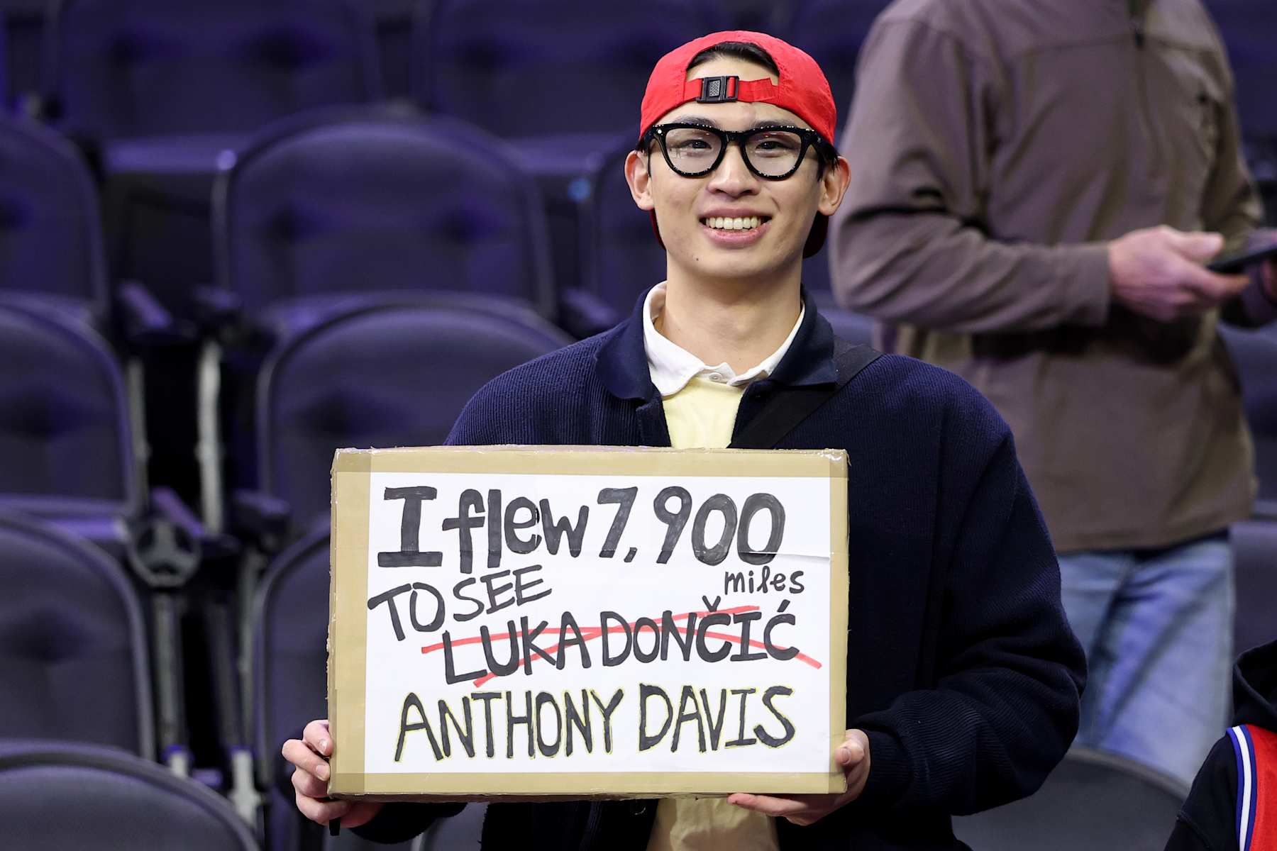 PHILADELPHIA, PENNSYLVANIA - FEBRUARY 04: A fan holds a sign for Luka Doncic and Anthony Davis during warmups prior to a game between the Philadelphia 76ers and Dallas Mavericks at the Wells Fargo Center on February 04, 2025 in Philadelphia, Pennsylvania. NOTE TO USER: User expressly acknowledges and agrees that, by downloading and or using this photograph, User is consenting to the terms and conditions of the Getty Images License Agreement. (Photo by Emilee Chinn/Getty Images)