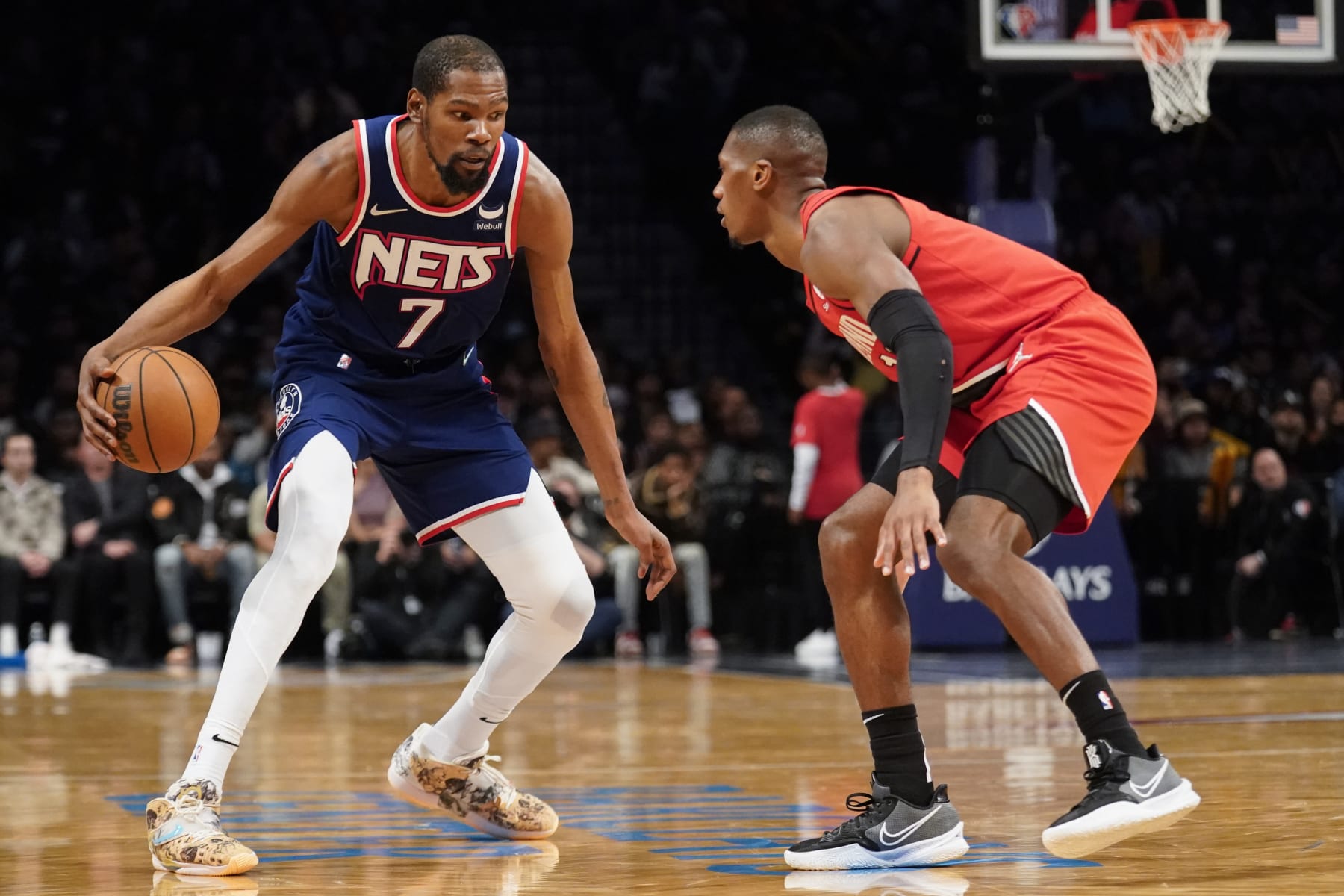 Brooklyn Nets forward Kevin Durant (7) drives against Portland Trail Blazers guard Josh Hart, right, in the second half of an NBA basketball game, Friday, March 18, 2022, in New York. (AP Photo/John Minchillo)