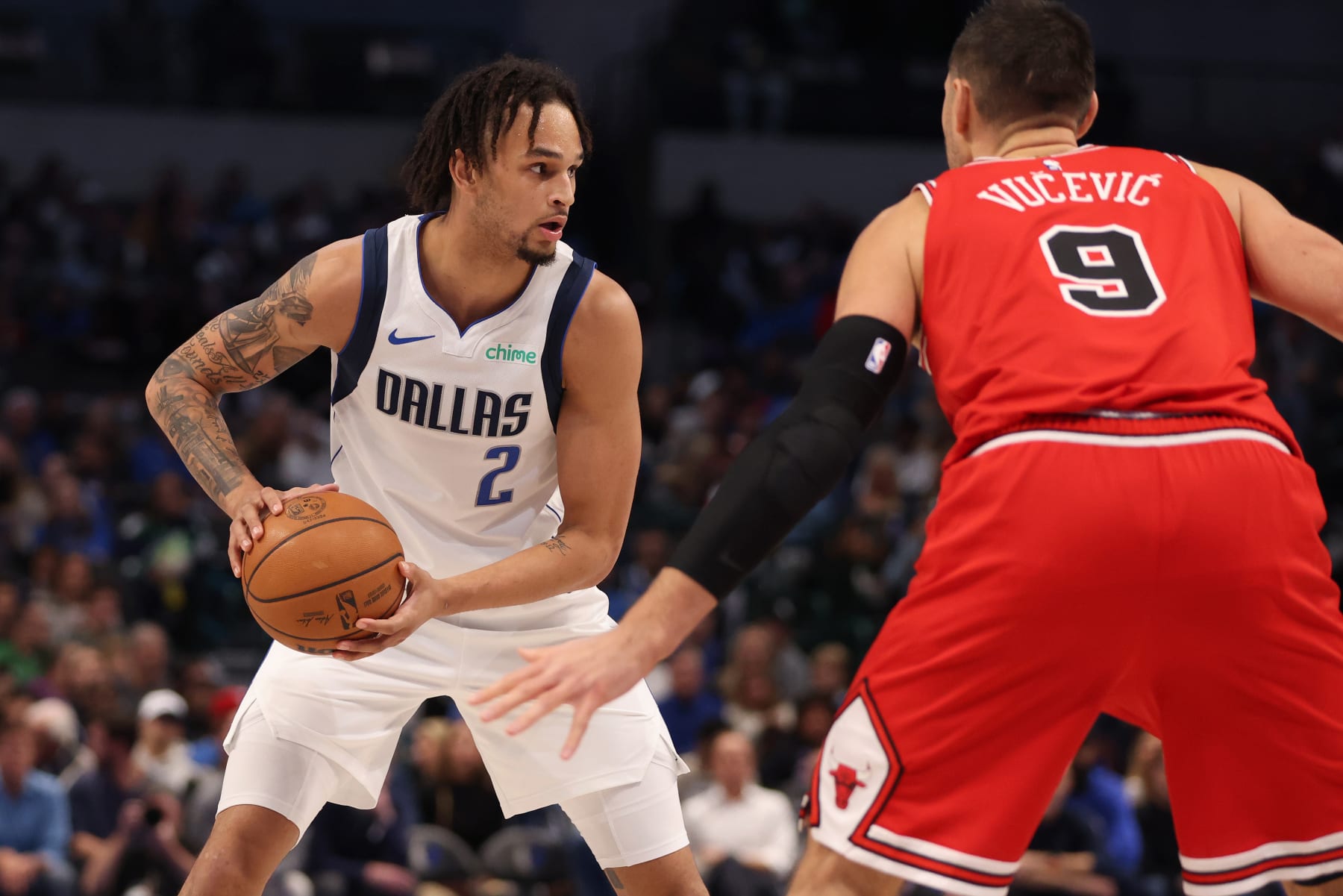 DALLAS, TEXAS - NOVEMBER 01: Dereck Lively II #2 of the Dallas Mavericks looks to pass the ball against Nikola Vucevic #9 of the Chicago Bulls in the first half at American Airlines Center on November 01, 2023 in Dallas, Texas. NOTE TO USER: User expressly acknowledges and agrees that, by downloading and or using this photograph, User is consenting to the terms and conditions of the Getty Images License Agreement. (Photo by Tim Heitman/Getty Images)