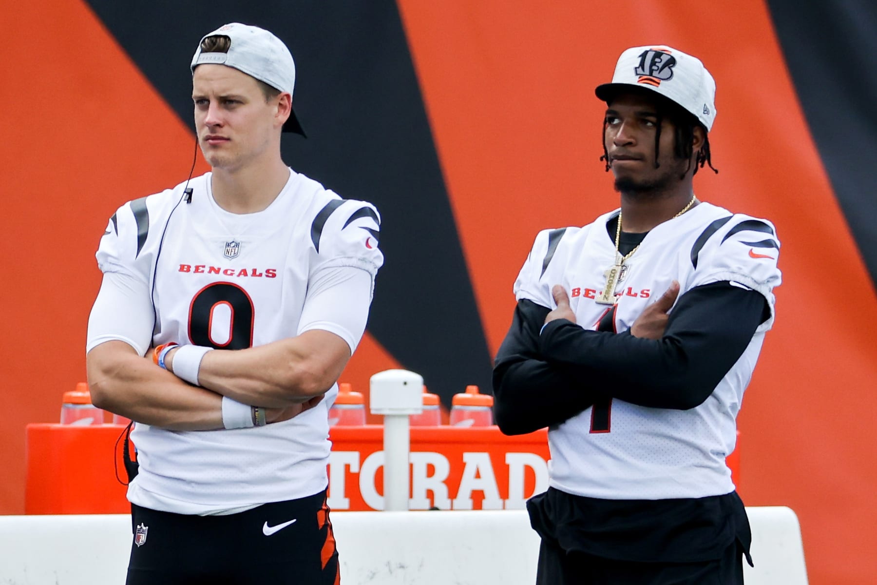 CINCINNATI, OHIO - AUGUST 29: Joe Burrow #9 and Ja'Marr Chase #1 of the Cincinnati Bengals look on from the sideline in the third quarter against the Miami Dolphins during a preseason game at Paul Brown Stadium on August 29, 2021 in Cincinnati, Ohio. (Photo by Dylan Buell/Getty Images)