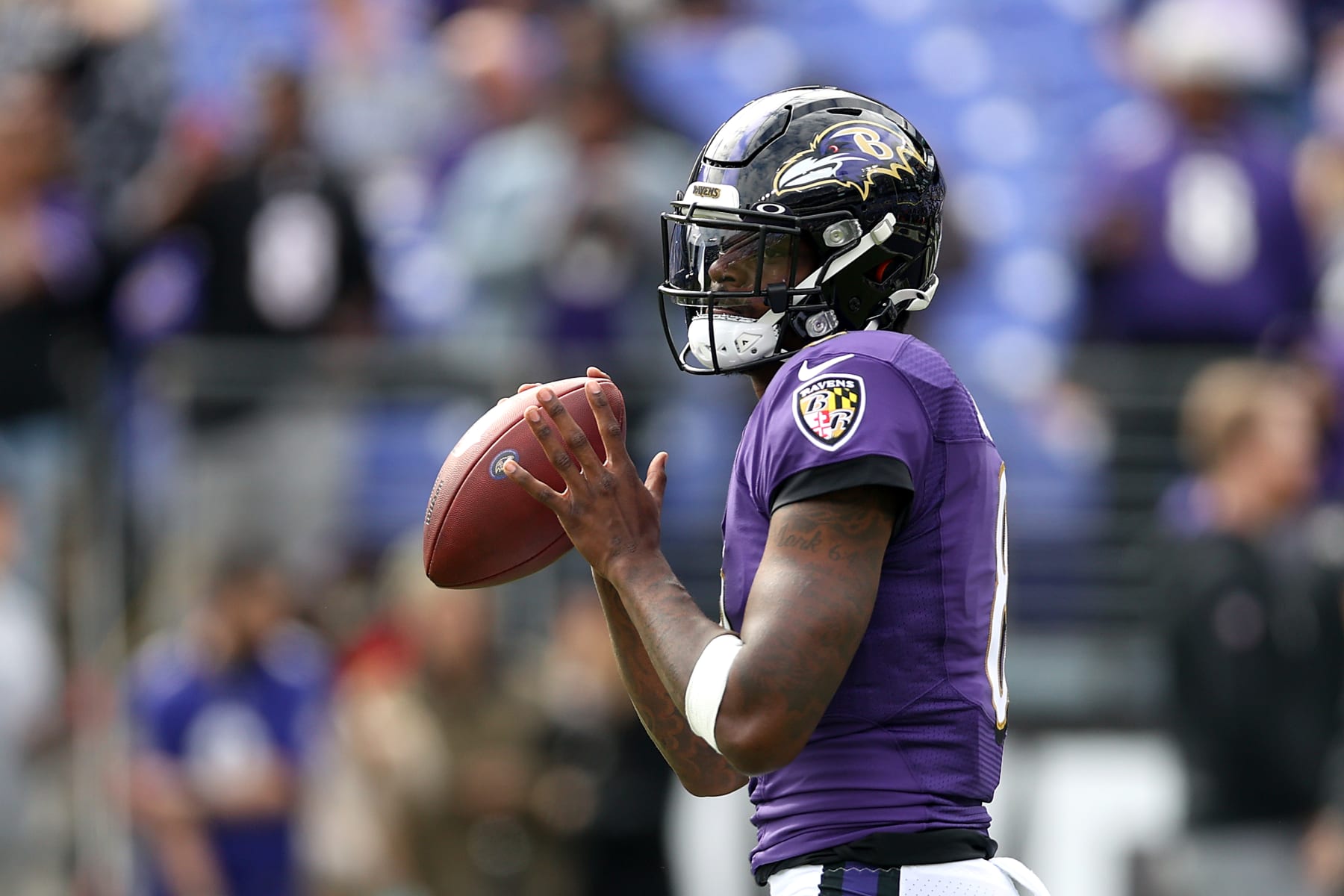 BALTIMORE, MARYLAND - OCTOBER 24: Quarterback Lamar Jackson #8 of the Baltimore Ravens warms up against the Cincinnati Bengals at M&T Bank Stadium on October 24, 2021 in Baltimore, Maryland. (Photo by Rob Carr/Getty Images)