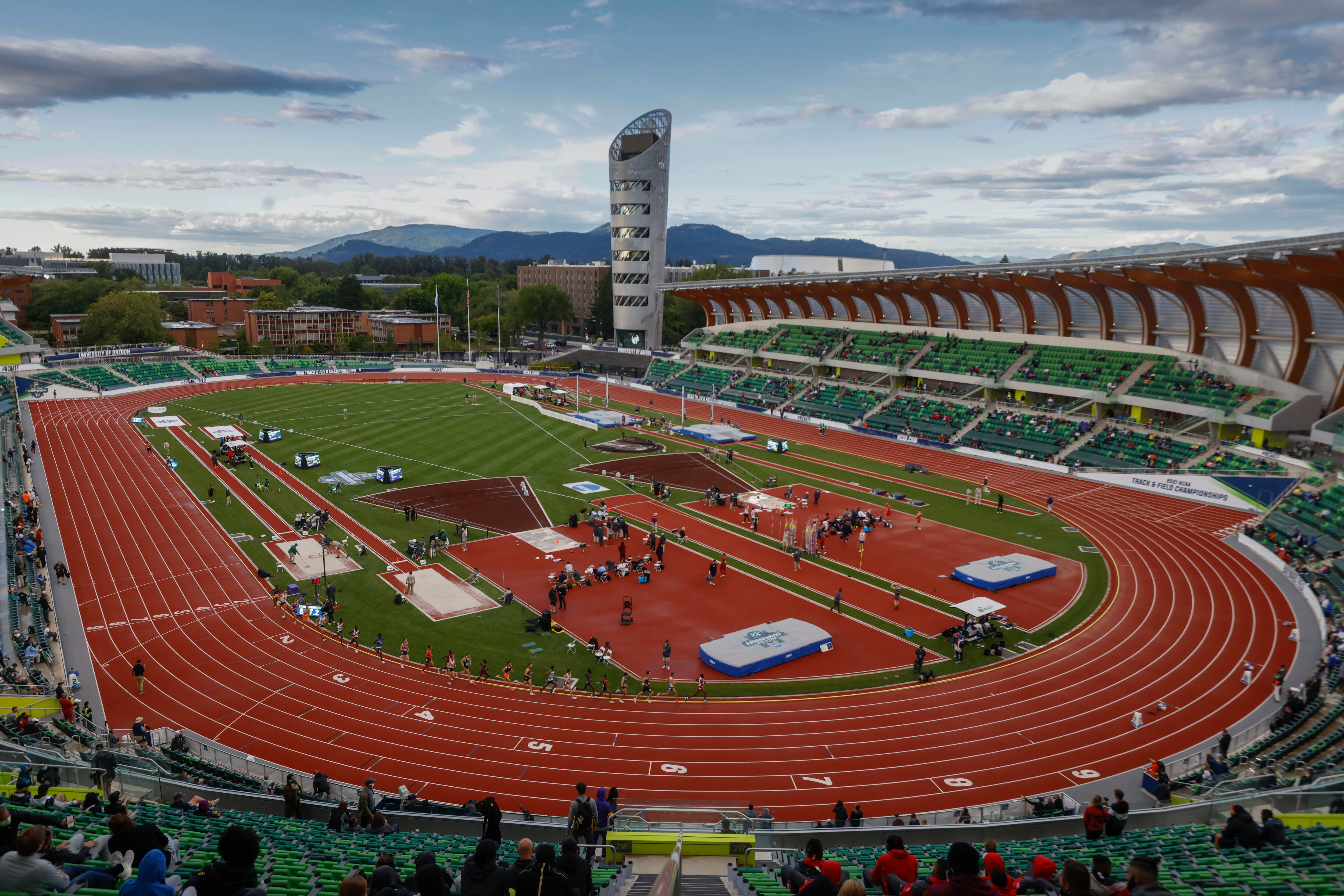Runners compete in the men's 10,000 meters during the NCAA Division I Outdoor Track and Field Championships, Wednesday, June 9, 2021, at Hayward Field in Eugene, Ore. (AP Photo/Thomas Boyd)