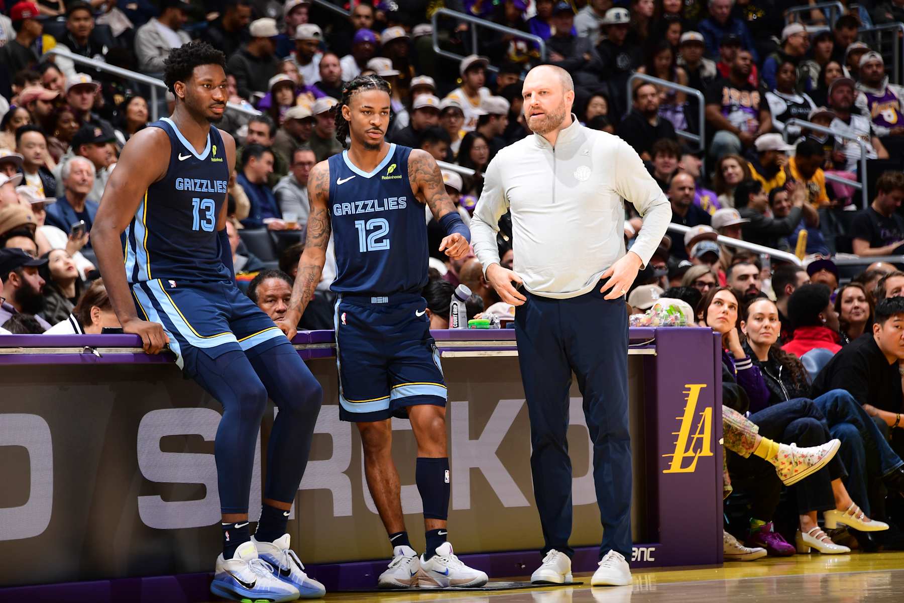 LOS ANGELES, CA - DECEMBER 15: Jaren Jackson Jr. #13, Ja Morant #12, and Head Coach Taylor Jenkins of the Memphis Grizzlies look on during the game against the Los Angeles Lakers on December 15, 2024 at Crypto.Com Arena in Los Angeles, California. NOTE TO USER: User expressly acknowledges and agrees that, by downloading and/or using this Photograph, user is consenting to the terms and conditions of the Getty Images License Agreement. Mandatory Copyright Notice: Copyright 2024 NBAE (Photo by Adam Pantozzi/NBAE via Getty Images)