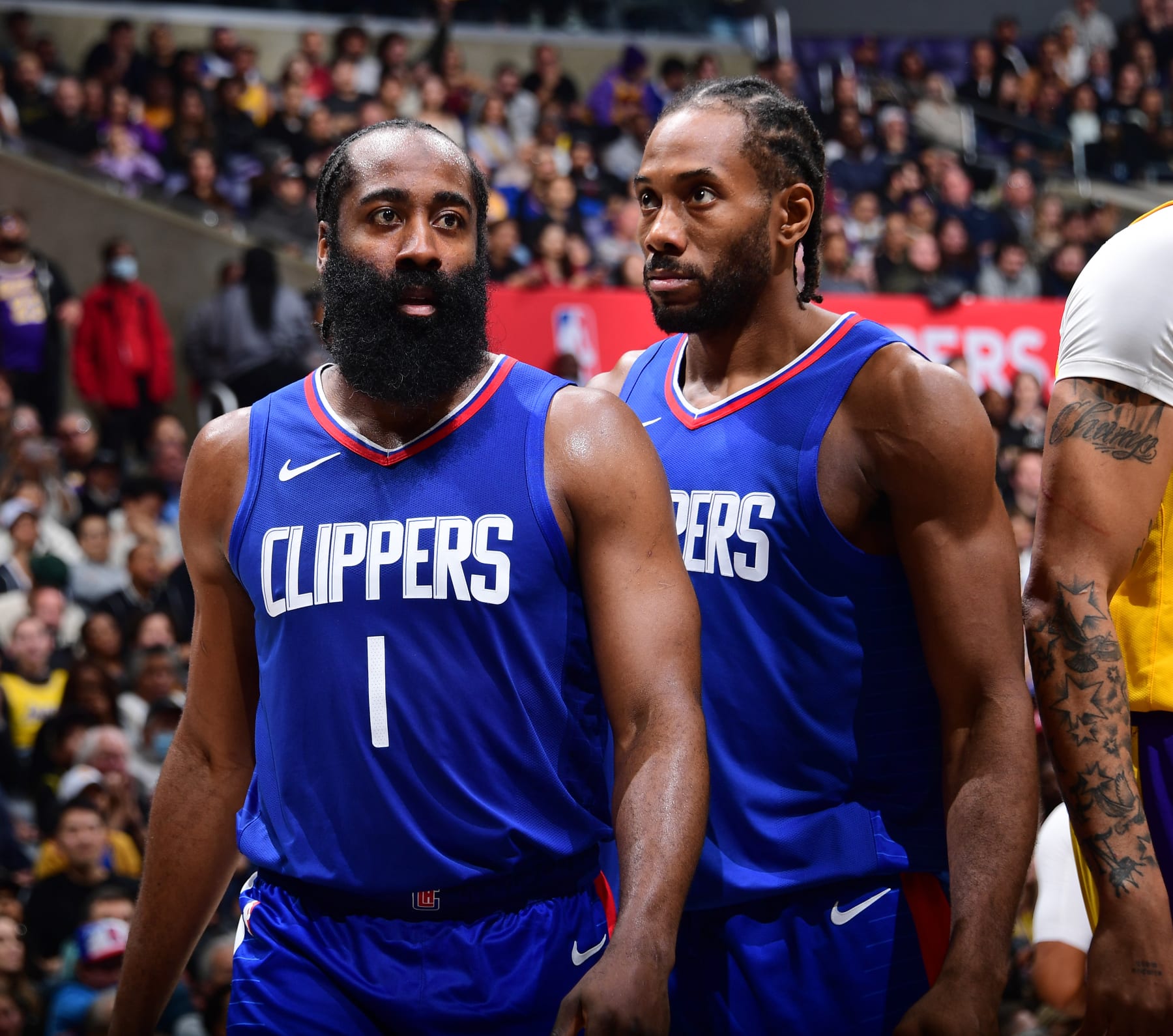 LOS ANGELES, CA - JANUARY 23: James Harden #1 and Kawhi Leonard #2 of the LA Clippers look on during the game against the Los Angeles Lakers on January 23, 2024 at Crypto.Com Arena in Los Angeles, California. NOTE TO USER: User expressly acknowledges and agrees that, by downloading and/or using this Photograph, user is consenting to the terms and conditions of the Getty Images License Agreement. Mandatory Copyright Notice: Copyright 2024 NBAE (Photo by Juan Ocampo/NBAE via Getty Images)