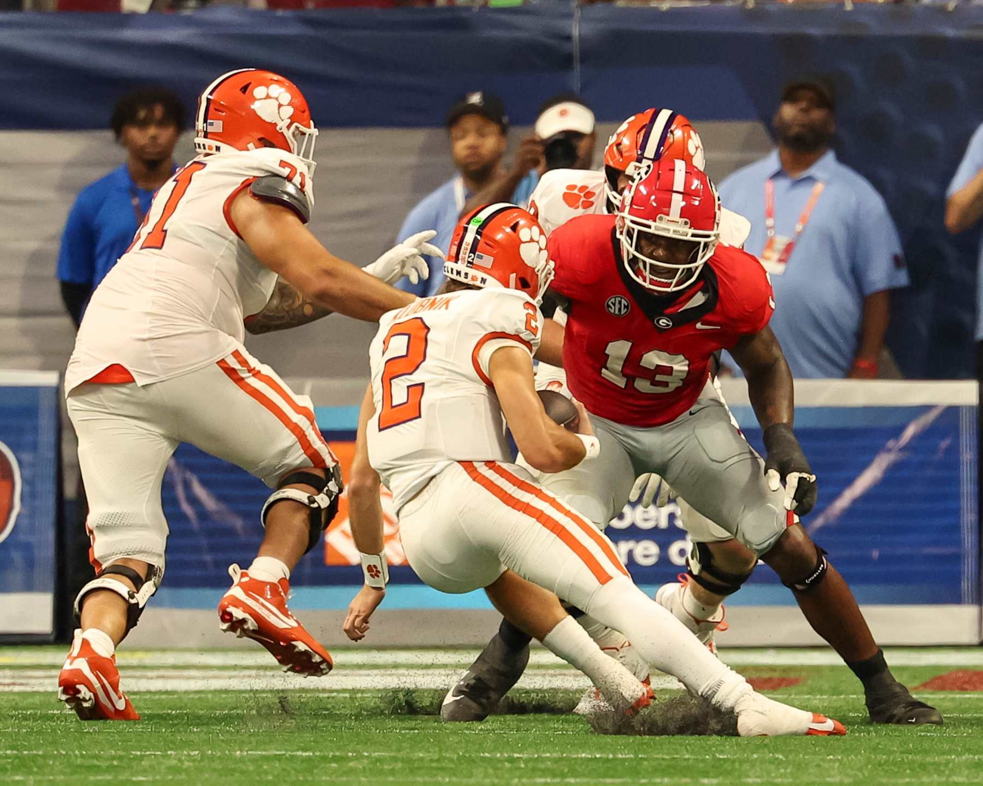 ATLANTA, GA - AUGUST 31: Mykel Williams #13 of the Georgia Bulldogs sacks Cade Klubnik #2 of the Clemson Tigers during a game between Clemson University and University of Georgia at Mercedes Benz Stadium on August 31, 2024 in Atlanta, Georgia. (Photo by Steve Limentani/ISI Photos/Getty Images)