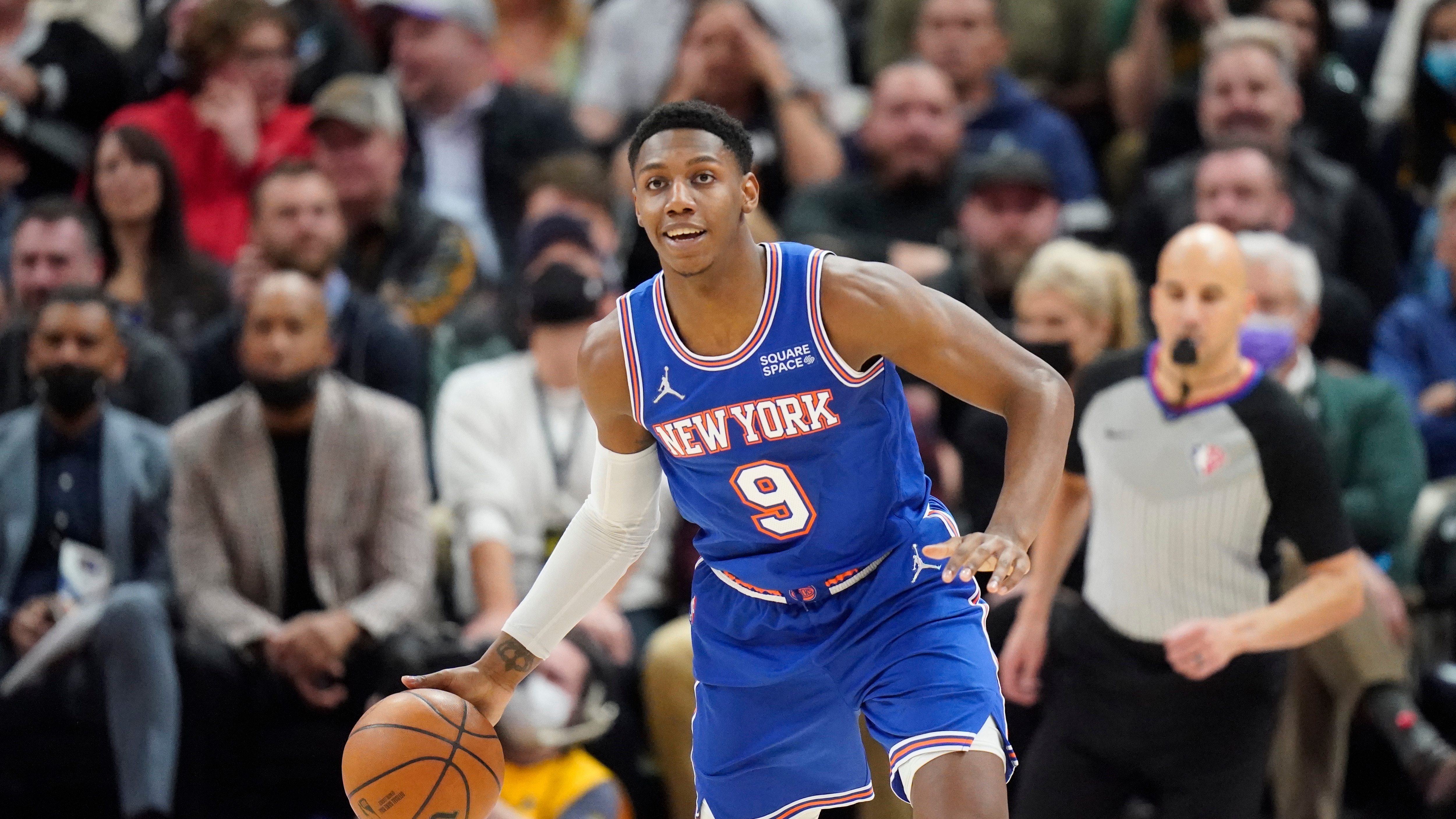 New York Knicks guard RJ Barrett (9) brings the ball up court in the second half during an NBA basketball game against the Utah Jazz Monday, Feb. 7, 2022, in Salt Lake City. (AP Photo/Rick Bowmer)