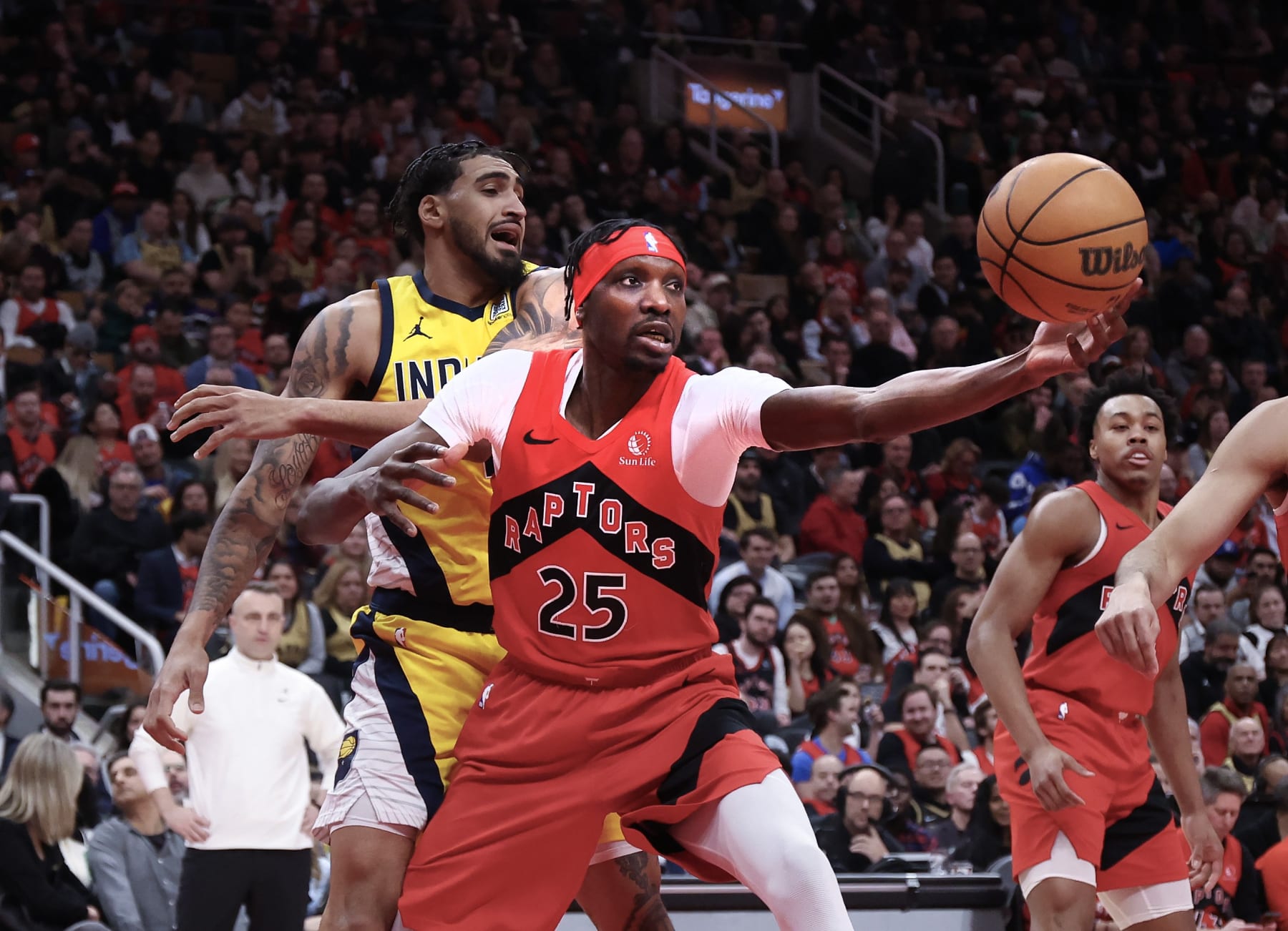 TORONTO, ON - February 14  In second half action, Chris Boucher (25) of the Toronto Raptors does a long reach for the ball under his own hoop.
The Toronto Raptors lost to the Indiana Pacers 125-127 in NBA basketball action at the Scotiabank Arena.  It is the first game back  in Toronto for the recently traded Pascal Siakam.
February 14 2024 Richard Lautens/Toronto Star        (Richard Lautens/Toronto Star via Getty Images)