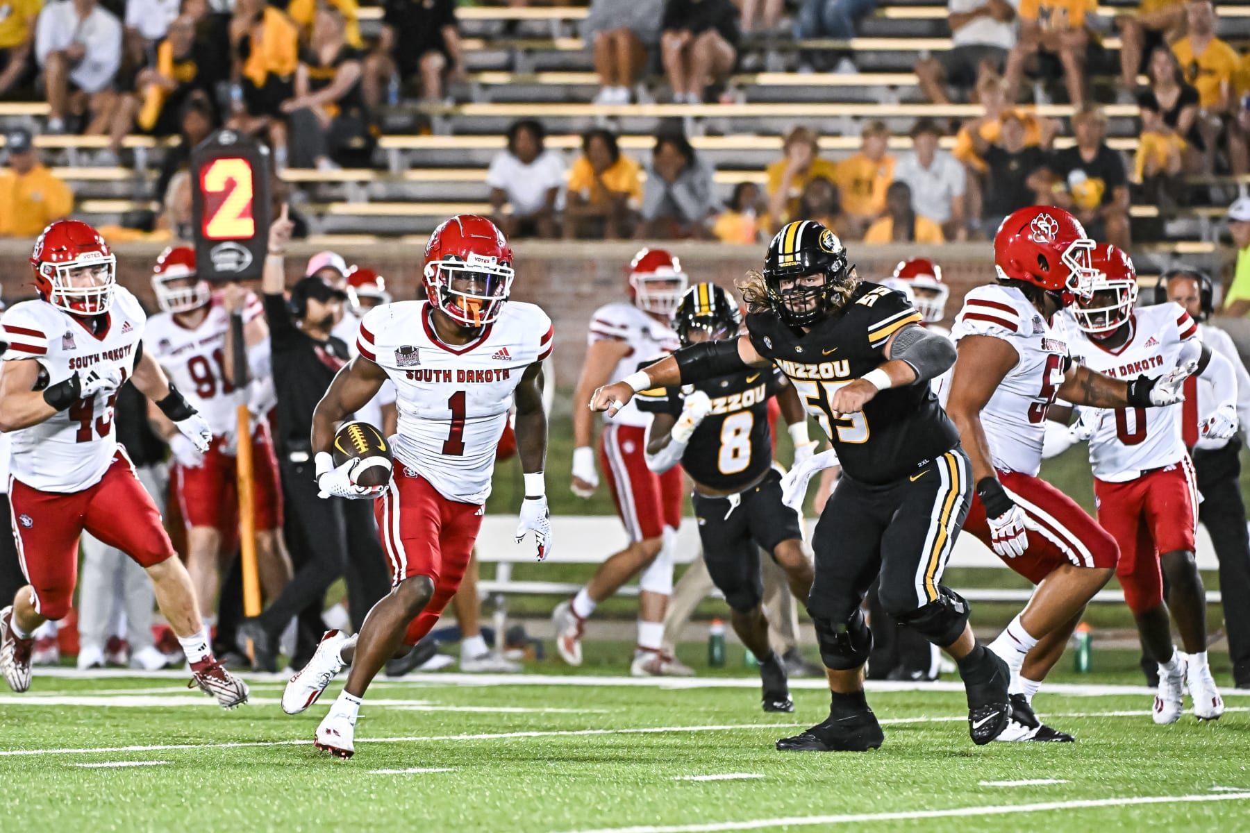 COLUMBIA, MO - AUGUST 31: After intercepting the ball, South Dakota Coyotes defensive back Myles Harden (1) runs with it for more yardage during a non conference game between the South Dakota Coyotes and the Missouri Tigers held on Thursday Aug 31, 2023 at Faurot Field at Memorial Stadium in Columbia MO. (Photo by Rick Ulreich/Icon Sportswire via Getty Images