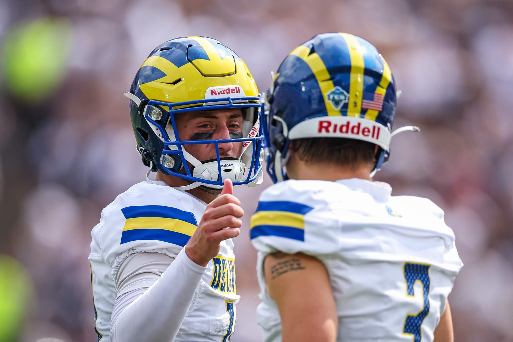 STATE COLLEGE, PA - SEPTEMBER 09: Ryan OConnor #14 of the Delaware Fightin Blue Hens interacts with Zach Marker #3 during the first half against the Penn State Nittany Lions at Beaver Stadium on September 9, 2023 in State College, Pennsylvania. (Photo by Scott Taetsch/Getty Images)