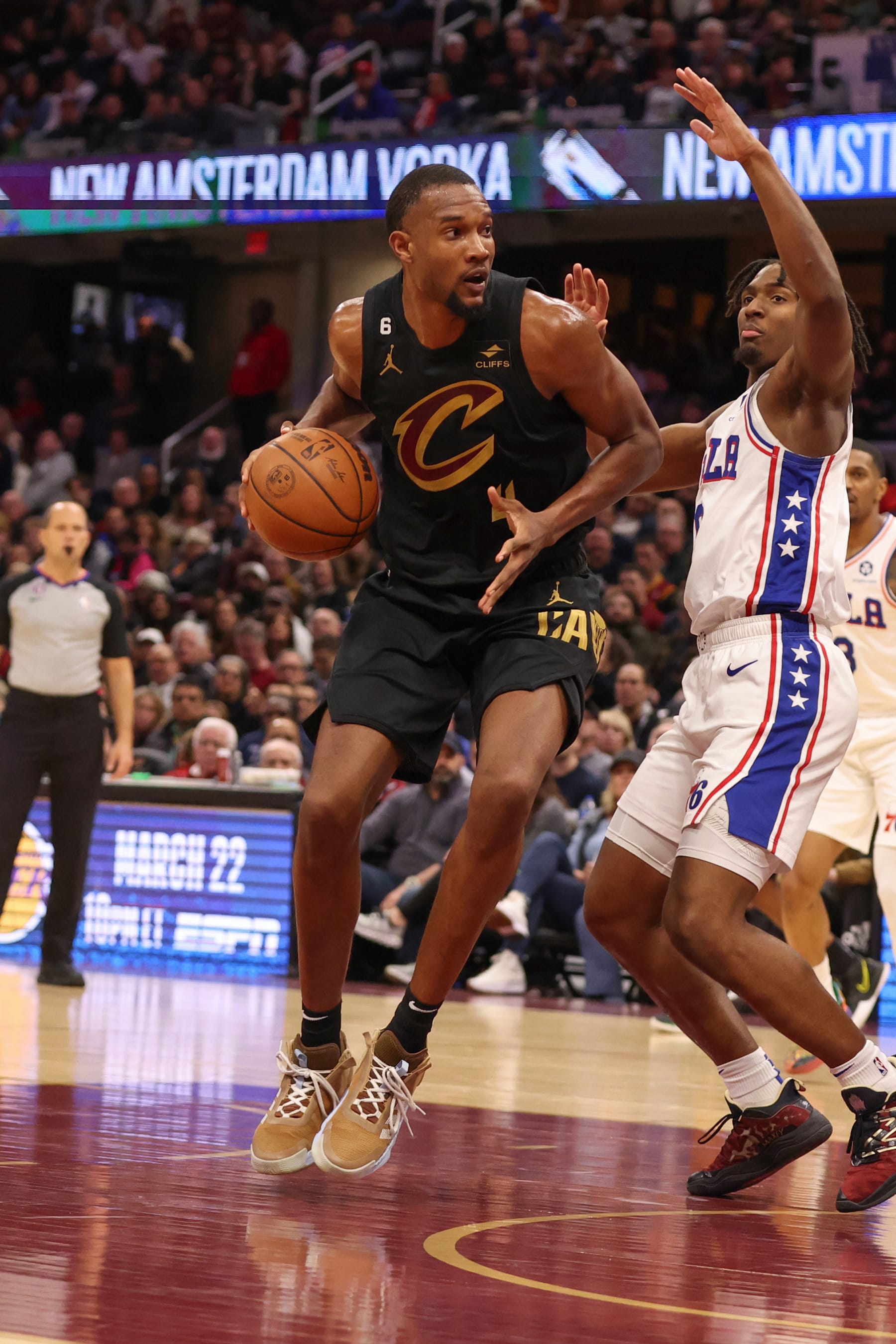 CLEVELAND, OH - MARCH 15:  Evan Mobley #4 of the Cleveland Cavaliers goes to the basket during the game on March 15, 2023 at Rocket Mortgage FieldHouse in Cleveland, Ohio. NOTE TO USER: User expressly acknowledges and agrees that, by downloading and/or using this Photograph, user is consenting to the terms and conditions of the Getty Images License Agreement. Mandatory Copyright Notice: Copyright 2023 NBAE (Photo by  Lauren Bacho/NBAE via Getty Images)