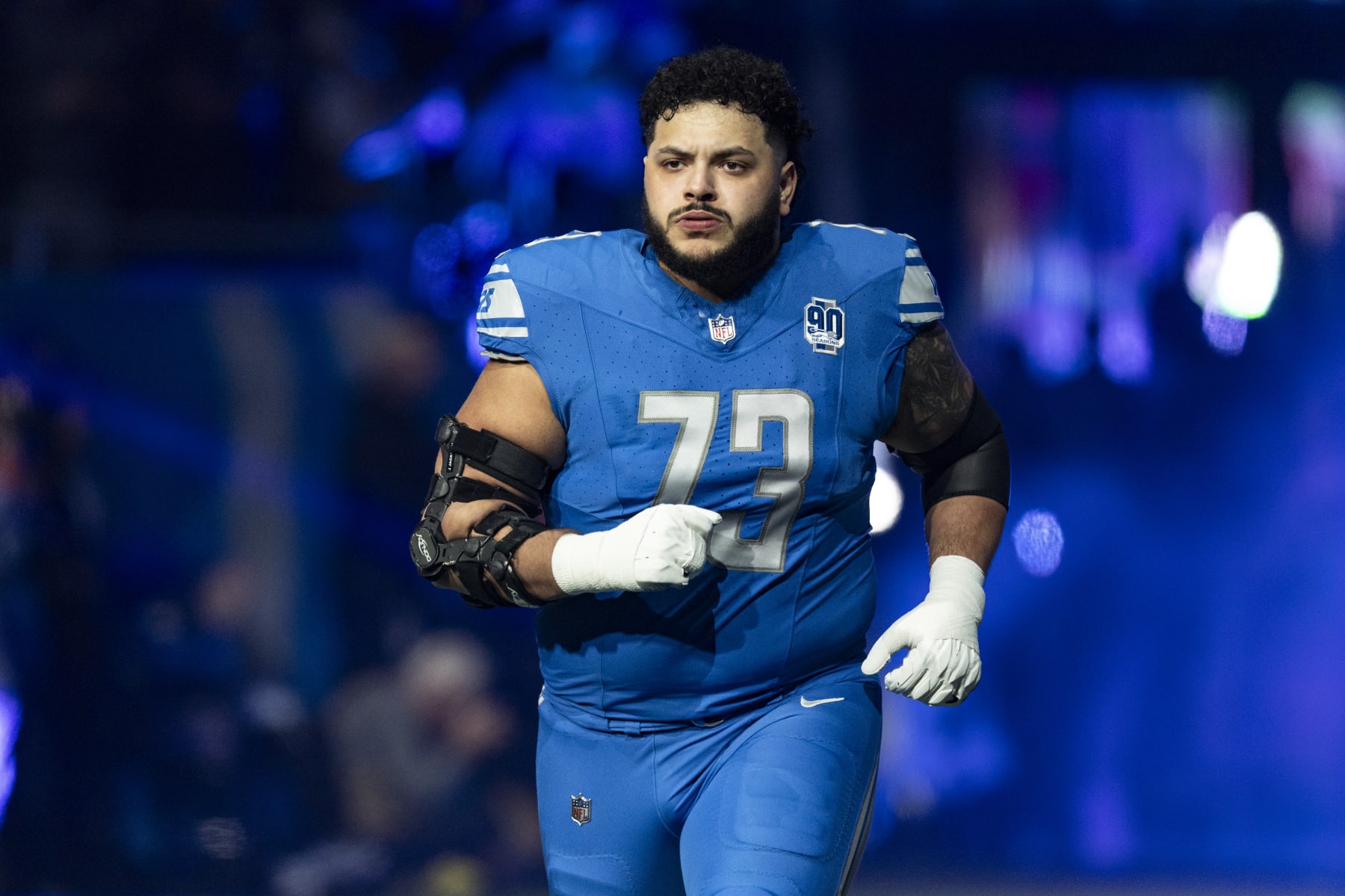 DETROIT, MICHIGAN - JANUARY 14: Jonah Jackson #73 of the Detroit Lions runs onto the field before the game against the Los Angeles Rams at Ford Field on January 14, 2024 in Detroit, Michigan. The Lions beat the Rams 24-23. (Photo by Lauren Leigh Bacho/Getty Images)