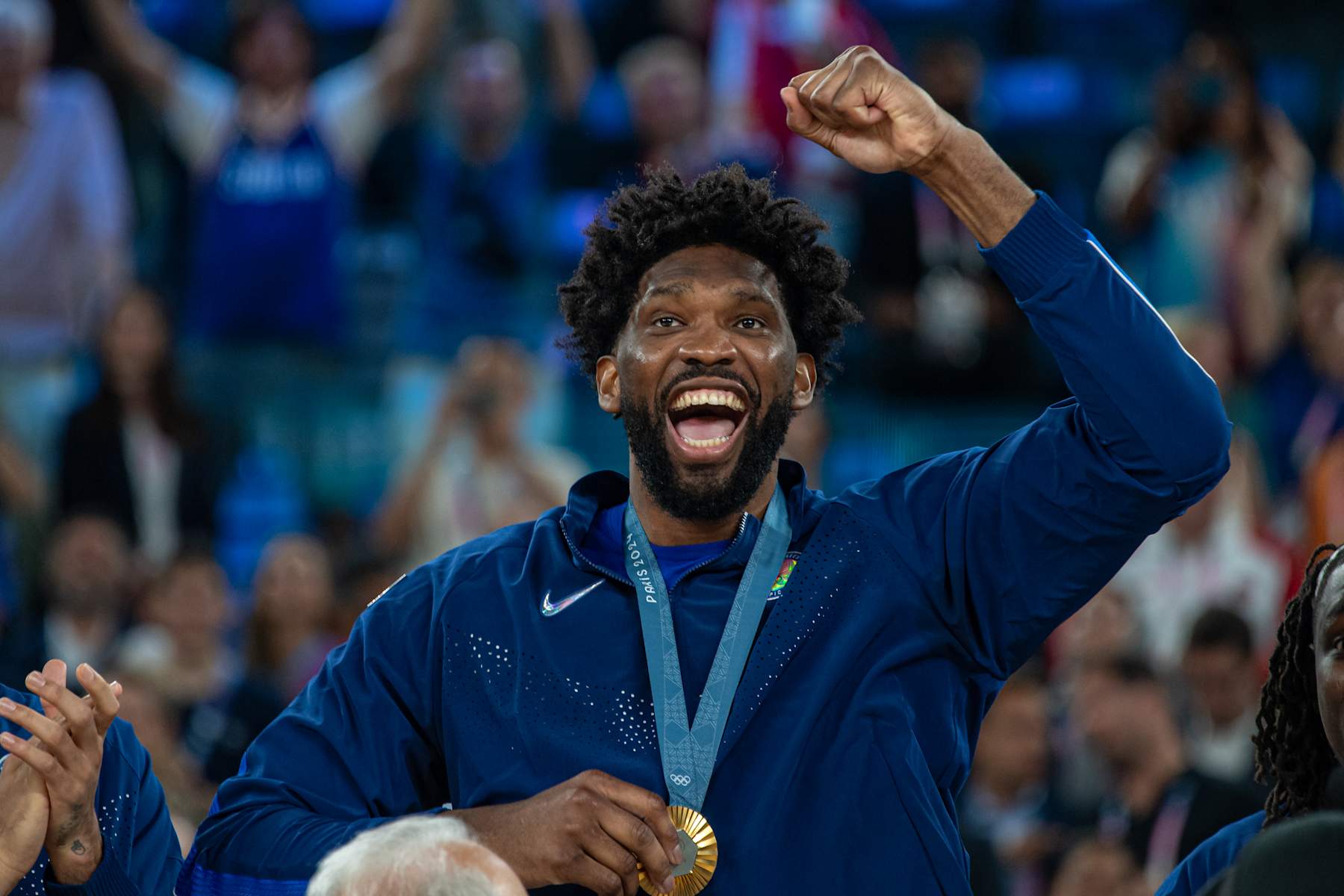 PARIS, FRANCE - AUGUST 10: Joel Embiid #11 of United States celebrates with his gold medal during the Men's Basketball Medal Ceremony on day fifteen of the Olympic Games Paris 2024 at Stade Bercy Arena on August 10, 2024 in Paris, France. (Photo by RvS.Media/Monika Majer/Getty Images)