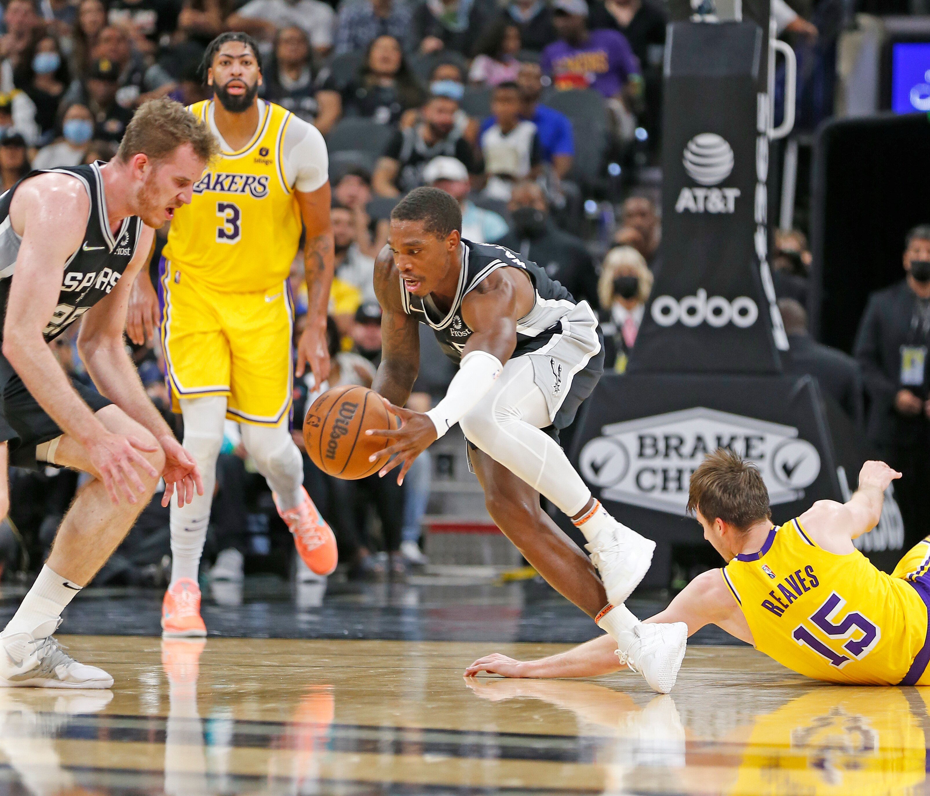 SAN ANTONIO, TX - OCTOBER  26:  Lonnie Walker #1 of the San Antonio Spurs steals the ball from Austin Reaves #15 of the Los Angeles Lakers in the first half at AT&T Center on October 26, 2021 in San Antonio, Texas.  NOTE TO USER: User expressly acknowledges and agrees that , by downloading and or using this photograph, User is consenting to the terms and conditions of the Getty Images License Agreement. (Photo by Ronald Cortes/Getty Images)