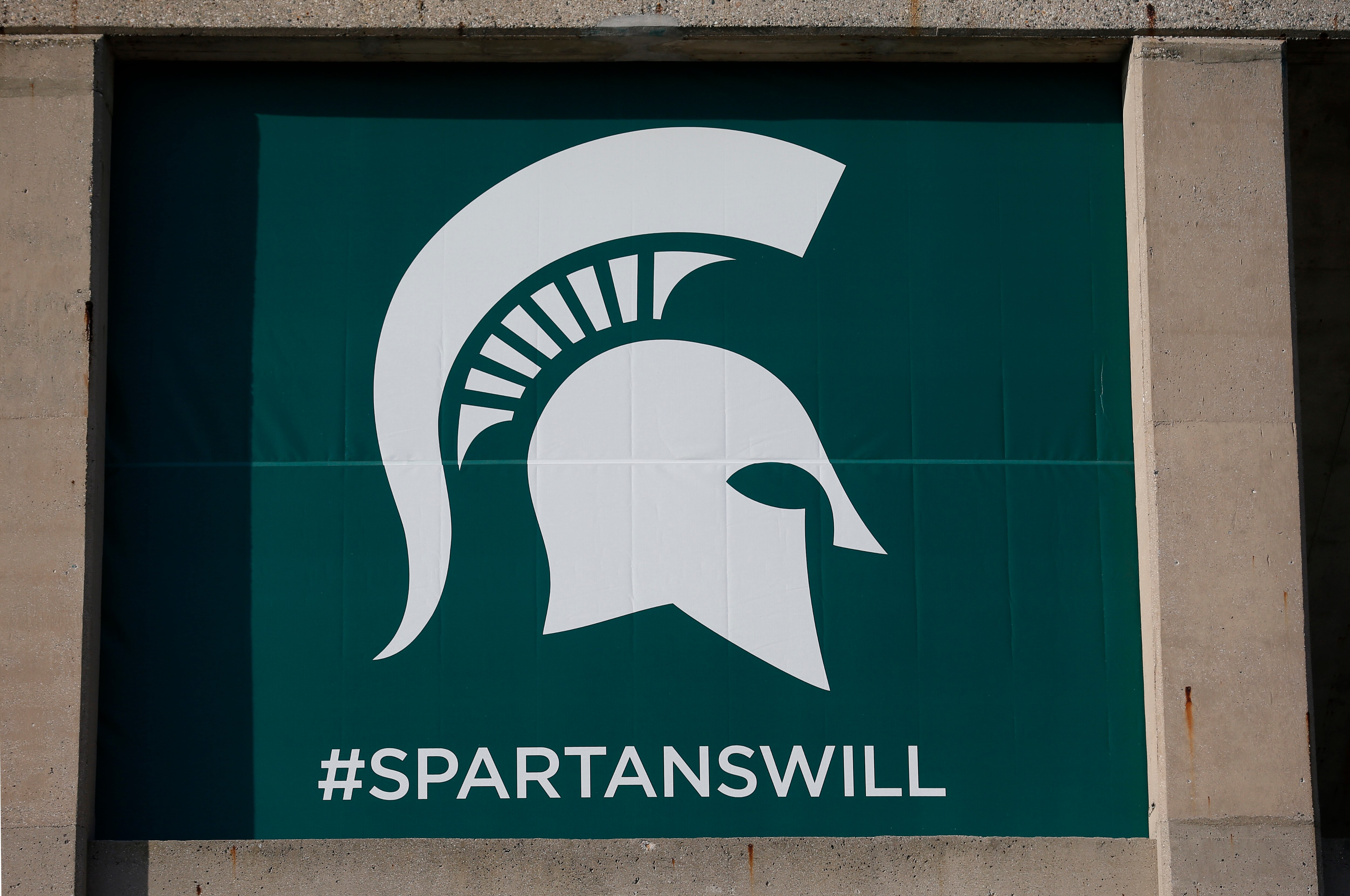 Michigan State's logo is seen on Spartan Stadium before the start of an NCAA college football game between Michigan State and Tulsa, Friday, Aug. 30, 2019, in East Lansing, Mich. (AP Photo/Al Goldis)