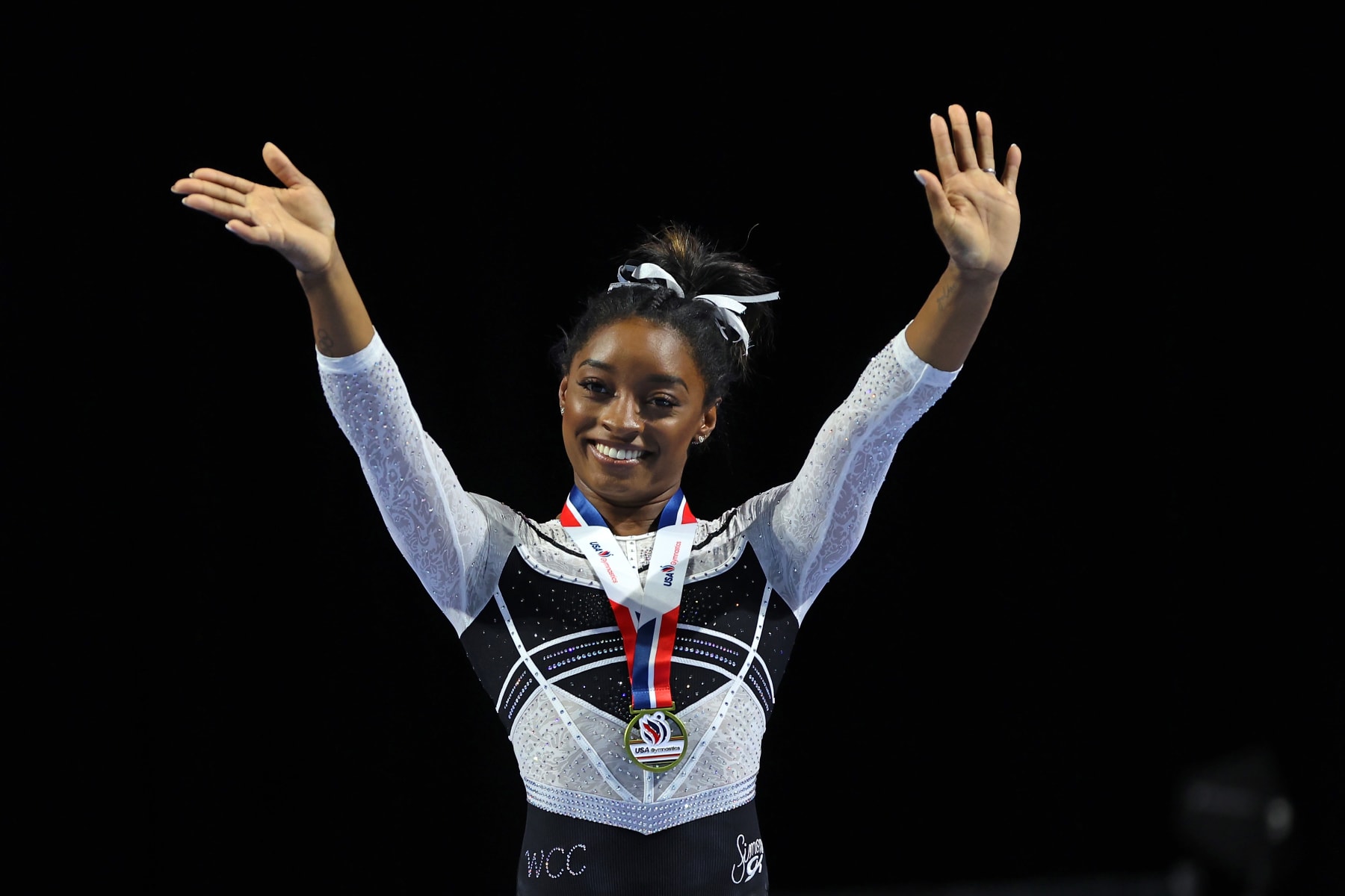 HOFFMAN ESTATES, ILLINOIS - AUGUST 05: Simone Biles celebrates after winning the all-around at the Core Hydration Classic at Now Arena on August 05, 2023 in Hoffman Estates, Illinois. (Photo by Stacy Revere/Getty Images)