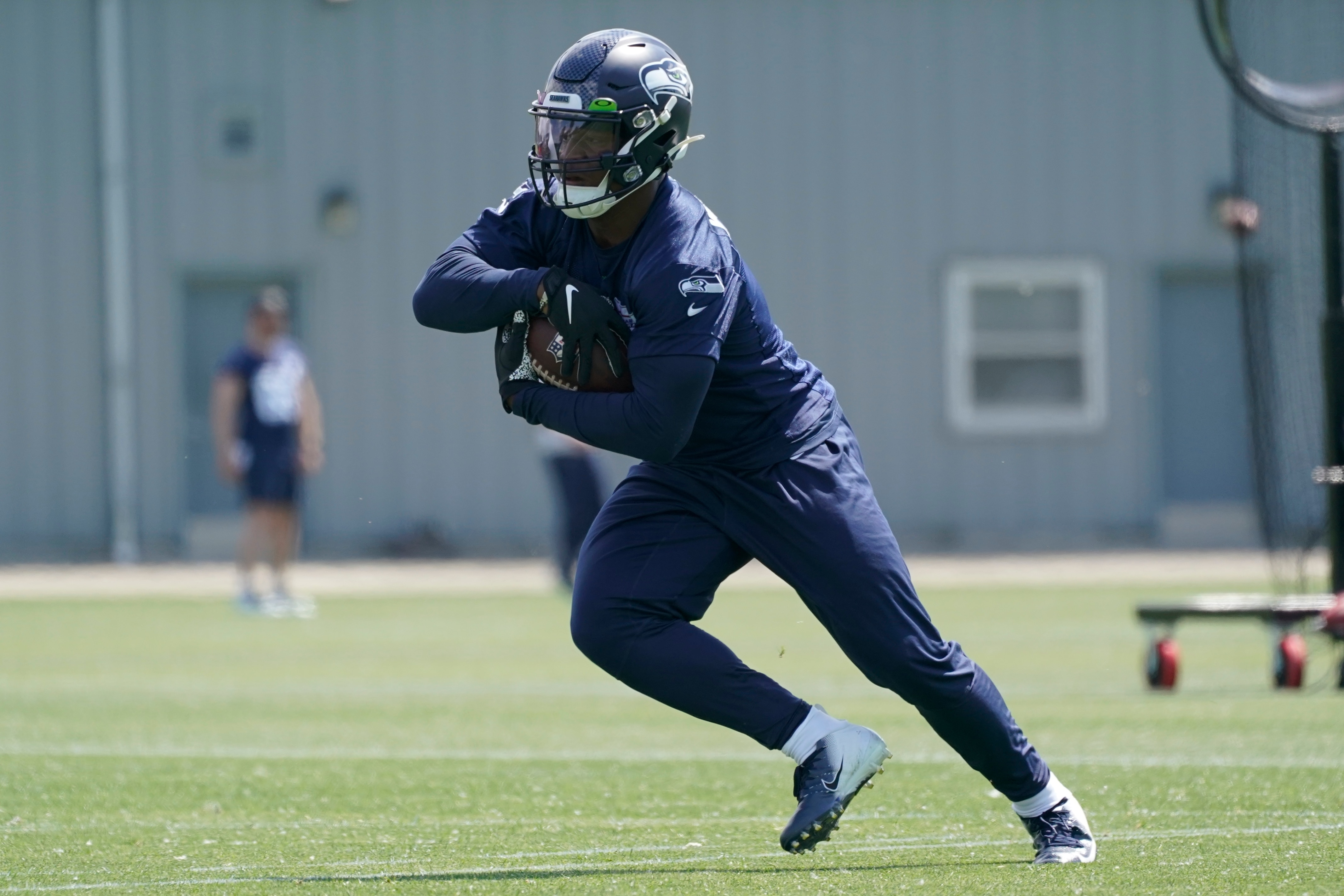 Running back Ken Walker III during NFL football practice Monday, May 23, 2022, in Renton, Wash. (AP Photo/Ted S. Warren)
