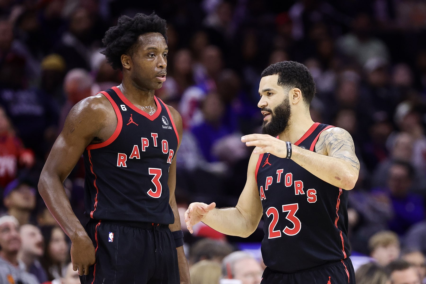PHILADELPHIA, PENNSYLVANIA - DECEMBER 19: O.G. Anunoby #3 and Fred VanVleet #23 of the Toronto Raptors speak during the third quarter at Wells Fargo Center on December 19, 2022 in Philadelphia, Pennsylvania. NOTE TO USER: User expressly acknowledges and agrees that, by downloading and or using this photograph, User is consenting to the terms and conditions of the Getty Images License Agreement. (Photo by Tim Nwachukwu/Getty Images)