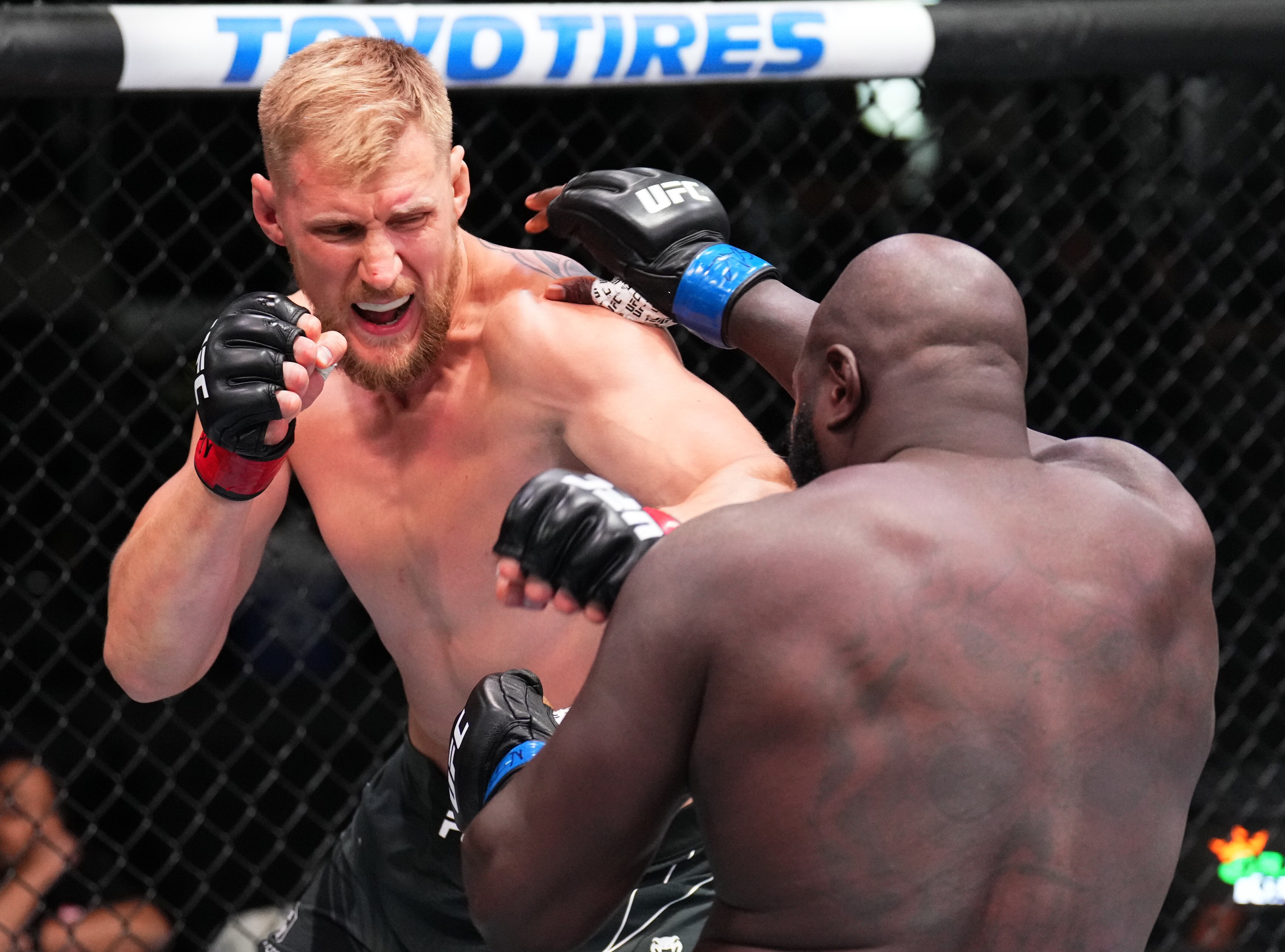 LAS VEGAS, NEVADA - JUNE 04: (L-R) Alexander Volkov of Russia punches Jairzinho Rozenstruik of Suriname in a heavyweight fight during the UFC Fight Night event at UFC APEX on June 04, 2022 in Las Vegas, Nevada. (Photo by Chris Unger/Zuffa LLC)