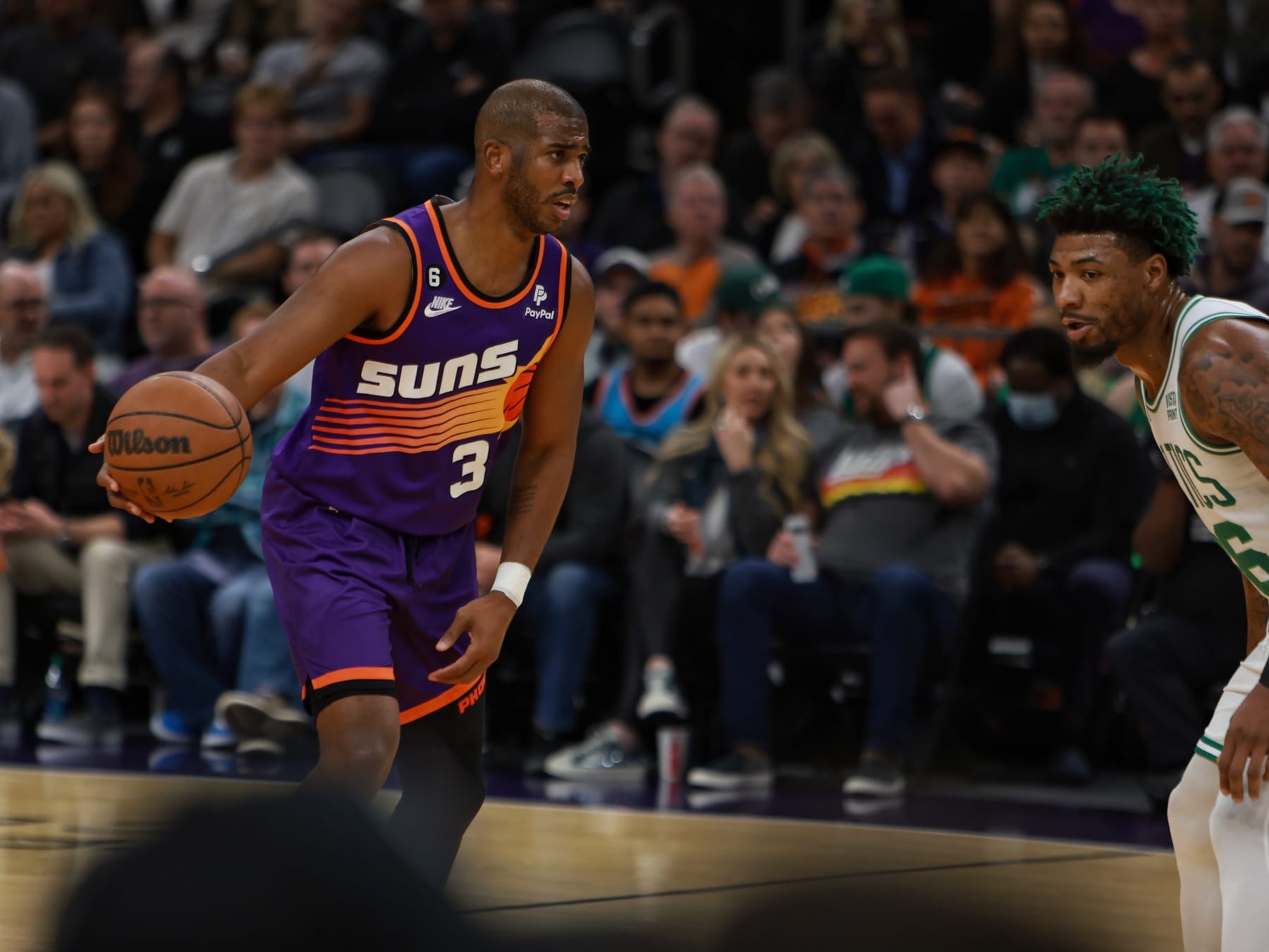 PHOENIX, AZ - DECEMBER 7: Chris Paul #3 of the Phoenix Suns dribbles the ball during the game against the Boston Celtics on December 7, 2022 at Footprint Center in Phoenix, Arizona. NOTE TO USER: User expressly acknowledges and agrees that, by downloading and or using this photograph, user is consenting to the terms and conditions of the Getty Images License Agreement. Mandatory Copyright Notice: Copyright 2022 NBAE (Photo by Jim Poorten/NBAE via Getty Images)
