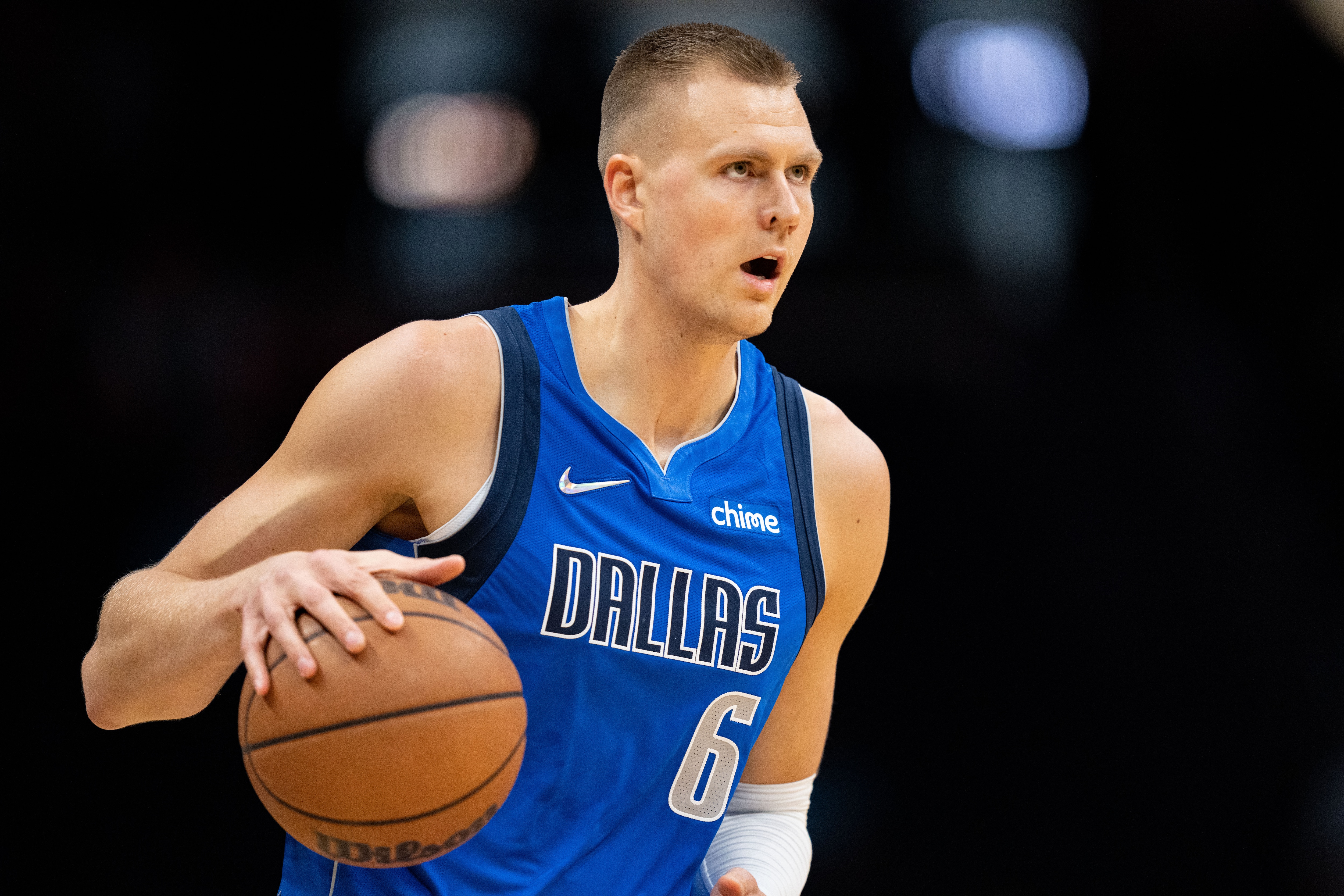 CHARLOTTE, NORTH CAROLINA - OCTOBER 13: Kristaps Porzingis #6 of the Dallas Mavericks brings the ball up court against the Charlotte Hornets during their game at Spectrum Center on October 13, 2021 in Charlotte, North Carolina. NOTE TO USER: User expressly acknowledges and agrees that, by downloading and or using this photograph, User is consenting to the terms and conditions of the Getty Images License Agreement. (Photo by Jacob Kupferman/Getty Images)