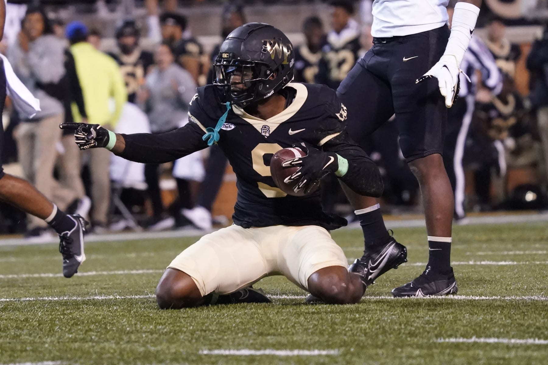 Wake Forest wide receiver A.T. Perry (9) celebrates after his catch against Army during the first half of an NCAA college football game in Winston-Salem, N.C., Saturday, Oct. 8, 2022. (AP Photo/Chuck Burton)