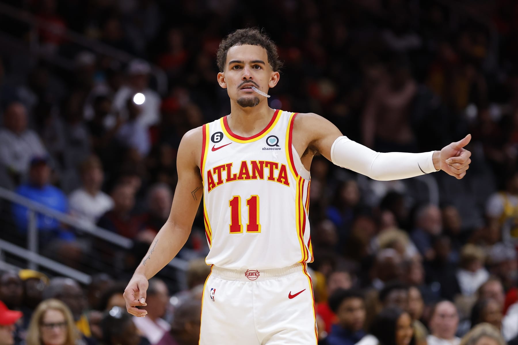 ATLANTA, GA - DECEMBER 11: Trae Young #11 of the Atlanta Hawks reacts during the second half against the Chicago Bulls at State Farm Arena on December 11, 2022 in Atlanta, Georgia. NOTE TO USER: User expressly acknowledges and agrees that, by downloading and or using this photograph, User is consenting to the terms and conditions of the Getty Images License Agreement. (Photo by Todd Kirkland/Getty Images) ATLANTA, GA - DECEMBER 11: Trae Young #11 of the Atlanta Hawks reacts during the second half against the Chicago Bulls at State Farm Arena on December 11, 2022 in Atlanta, Georgia. NOTE TO USER: User expressly acknowledges and agrees that, by downloading and or using this photograph, User is consenting to the terms and conditions of the Getty Images License Agreement. (Photo by Todd Kirkland/Getty Images)