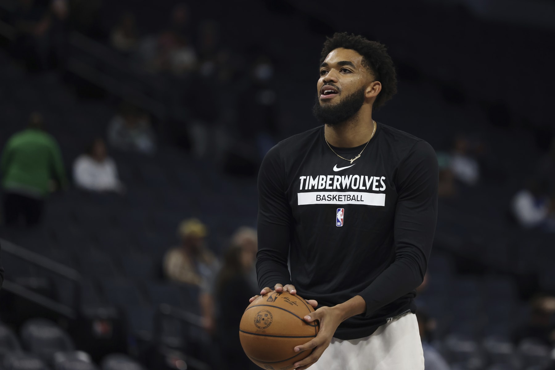 Minnesota Timberwolves center Karl-Anthony Towns warms up prior to a preseason NBA basketball game against the Brooklyn Nets, Friday, Oct. 14, 2022, in Minneapolis. (AP Photo/Stacy Bengs)