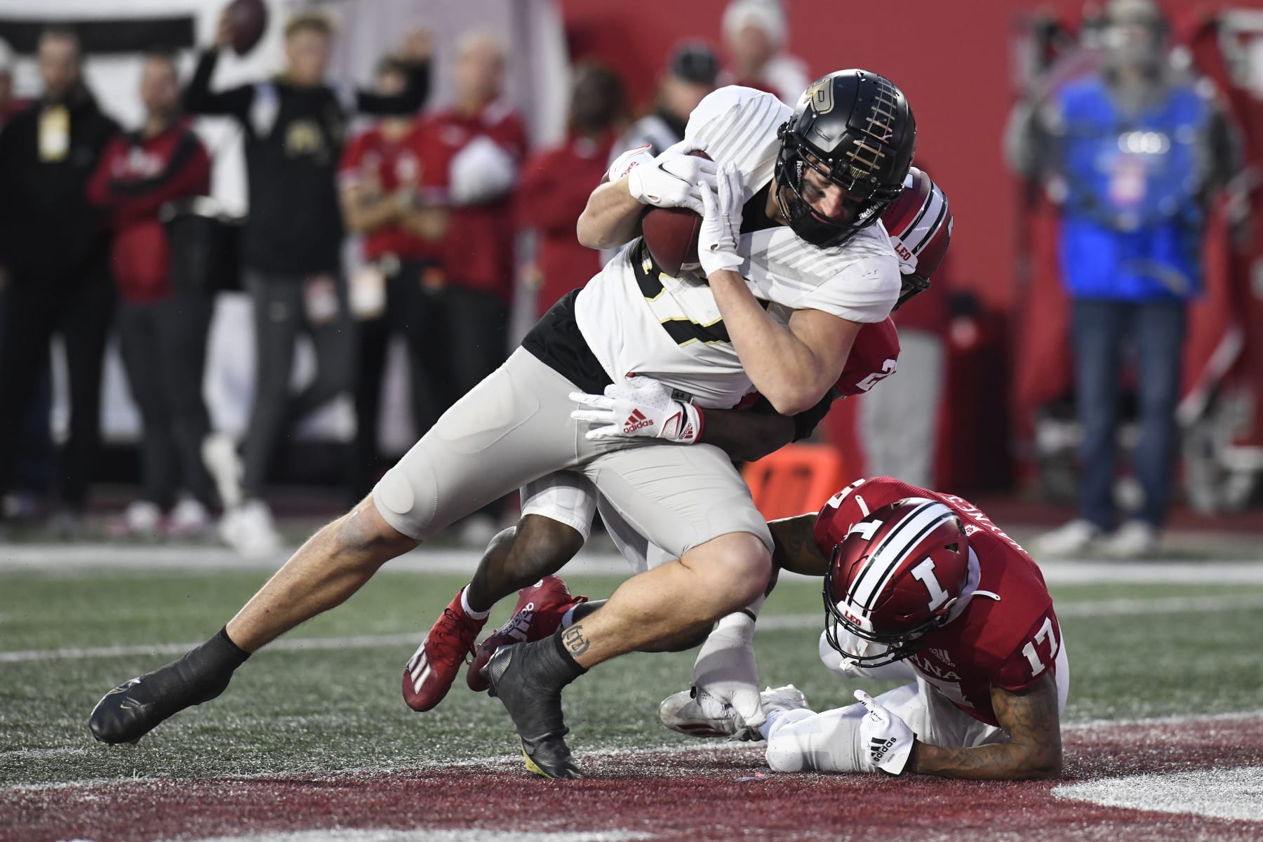 BLOOMINGTON, IN - NOVEMBER 26: Purdue Boilermakers tight end Payne Durham (87) scores a touchdown as Indiana Hoosiers defensive back Jaylin Williams (23) and Indiana Hoosiers defensive back Jonathan Haynes (17) defend during the college football game between the Purdue Boilermakers and the Indiana Hoosiers on November 26, 2022, at Memorial Stadium in Bloomington, Indiana. (Photo by Michael Allio/Icon Sportswire via Getty Images)