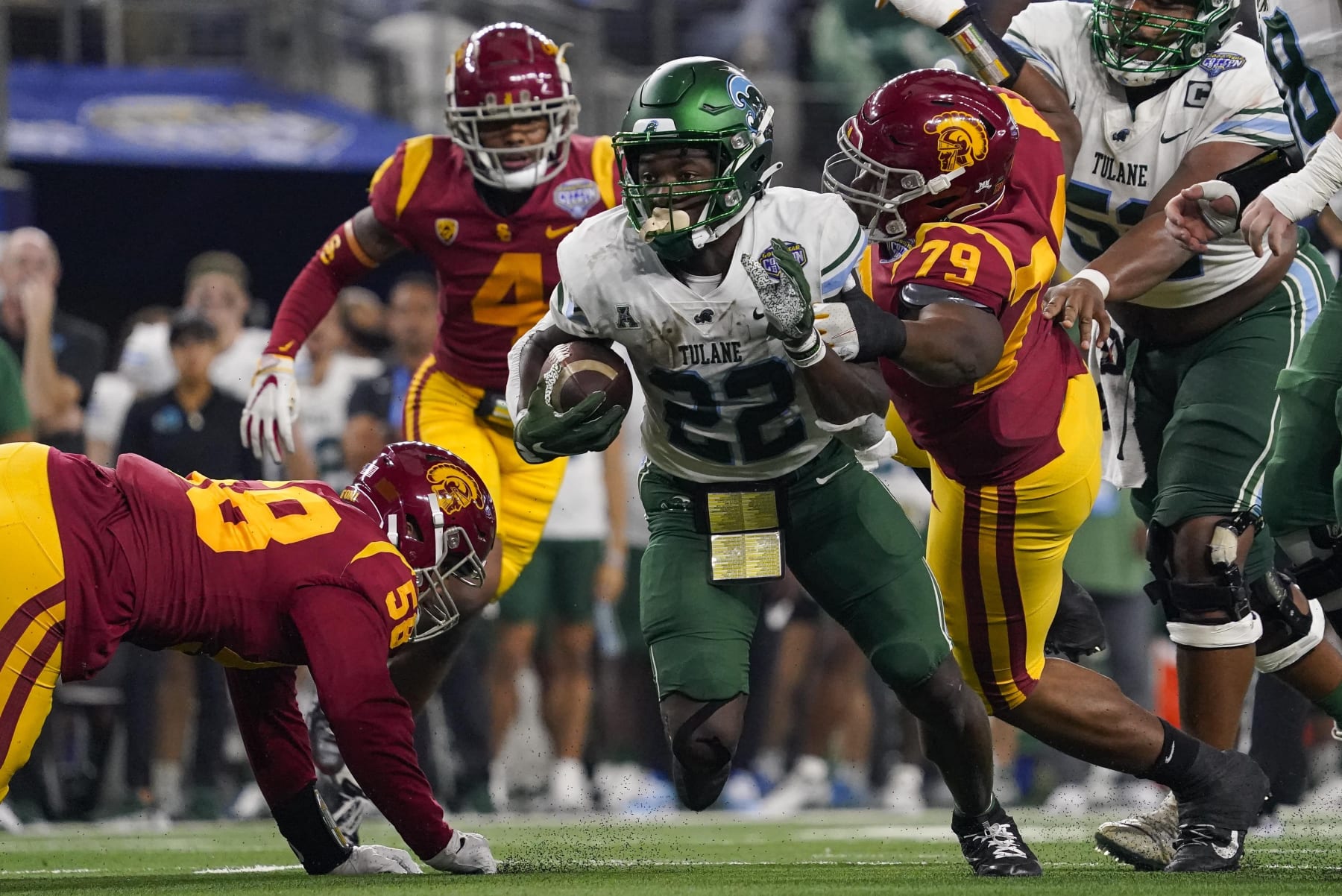 Tulane running back Tyjae Spears (22) runs with the ball during the second half of the Cotton Bowl NCAA college football game against Southern California, Monday, Jan. 2, 2023, in Arlington, Texas. (AP Photo/Sam Hodde)