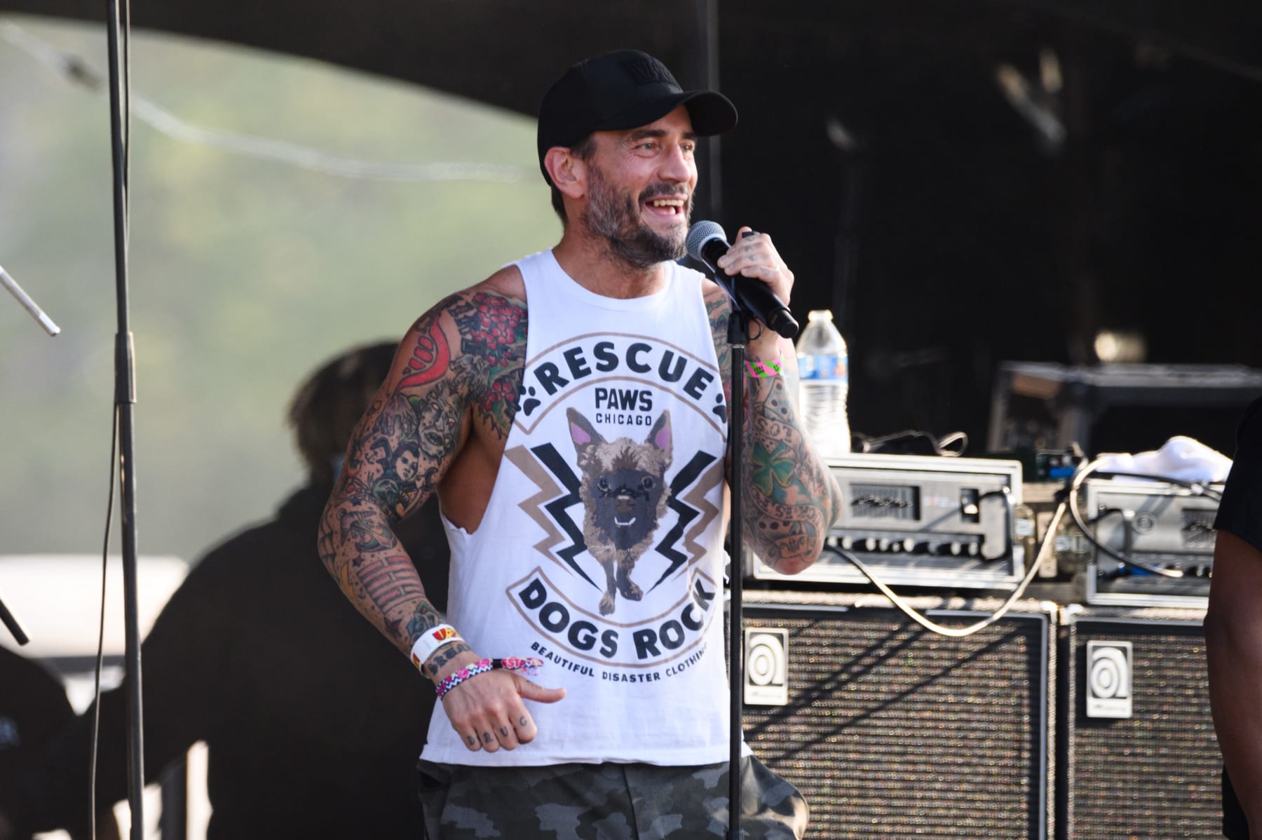 CHICAGO, ILLINOIS - SEPTEMBER 17: CM Punk speaks on stage at Living Colour's set during Riot Fest 2021 at Douglass Park on September 17, 2021 in Chicago, Illinois. (Photo by Daniel Boczarski/Getty Images)